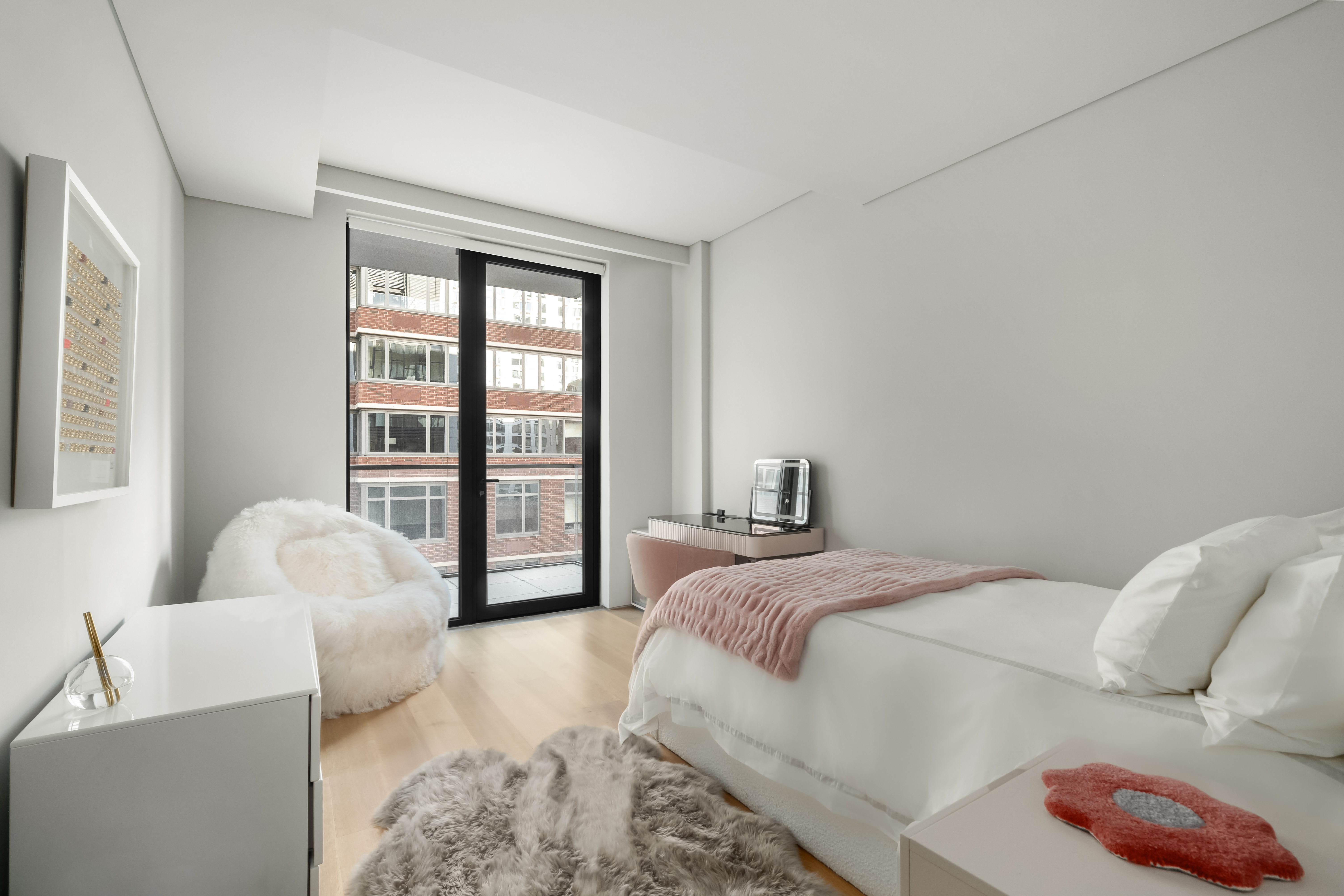 522 West 29th Street, Unit 7D Manhattan, NY 10001 - Photo 11 of 17 a bedroom with a bed and a couch