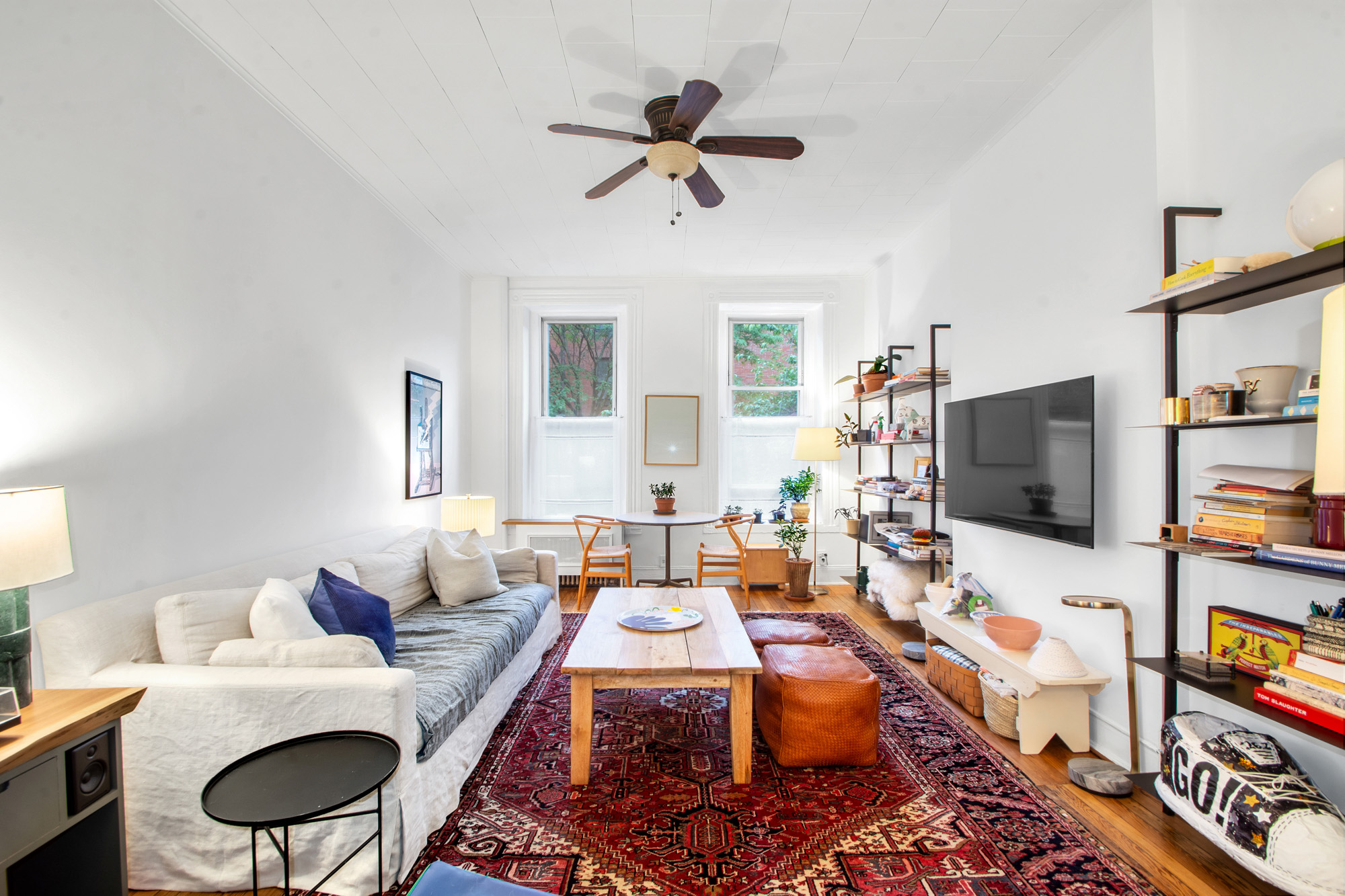545 10th Street Brooklyn, NY 11215 - Photo 5 of 11 a living room with furniture and a flat screen tv