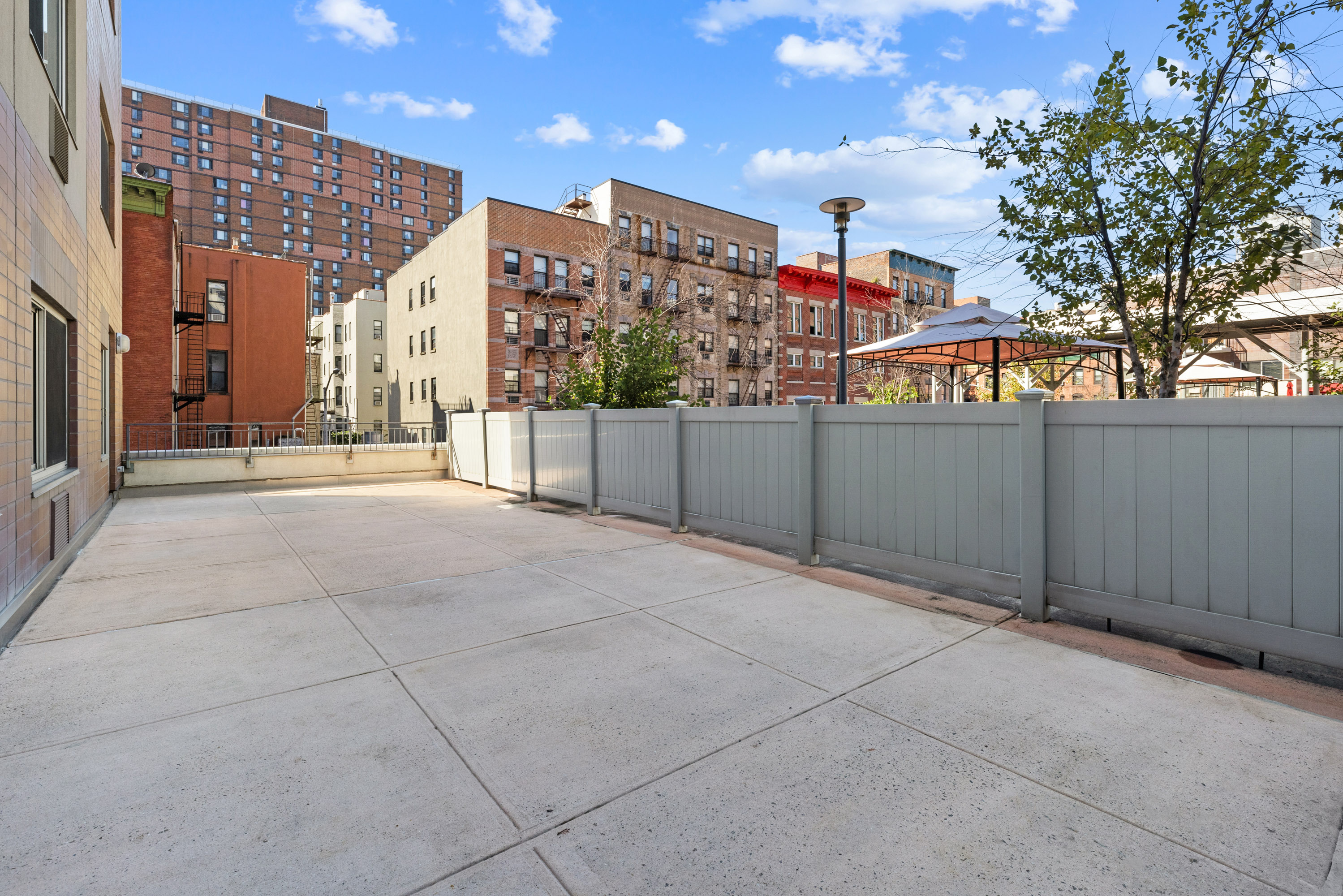 300 West 145th Street, Unit 1QQ Manhattan, NY 10039 - Photo 11 of 15 a view of a terrace with city view