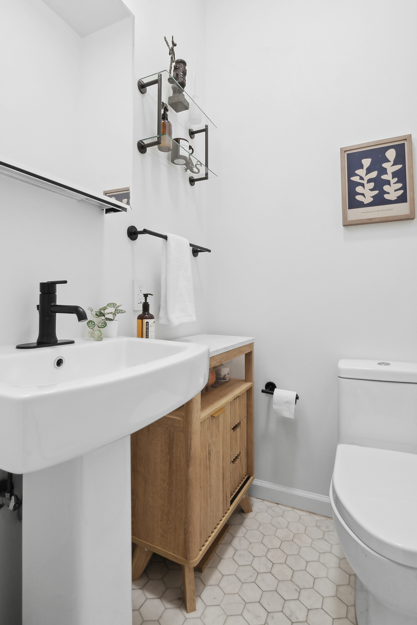 147 Herkimer Street Brooklyn, NY 11216 - Photo 11 of 25 a bathroom with a sink a toilet and mirror