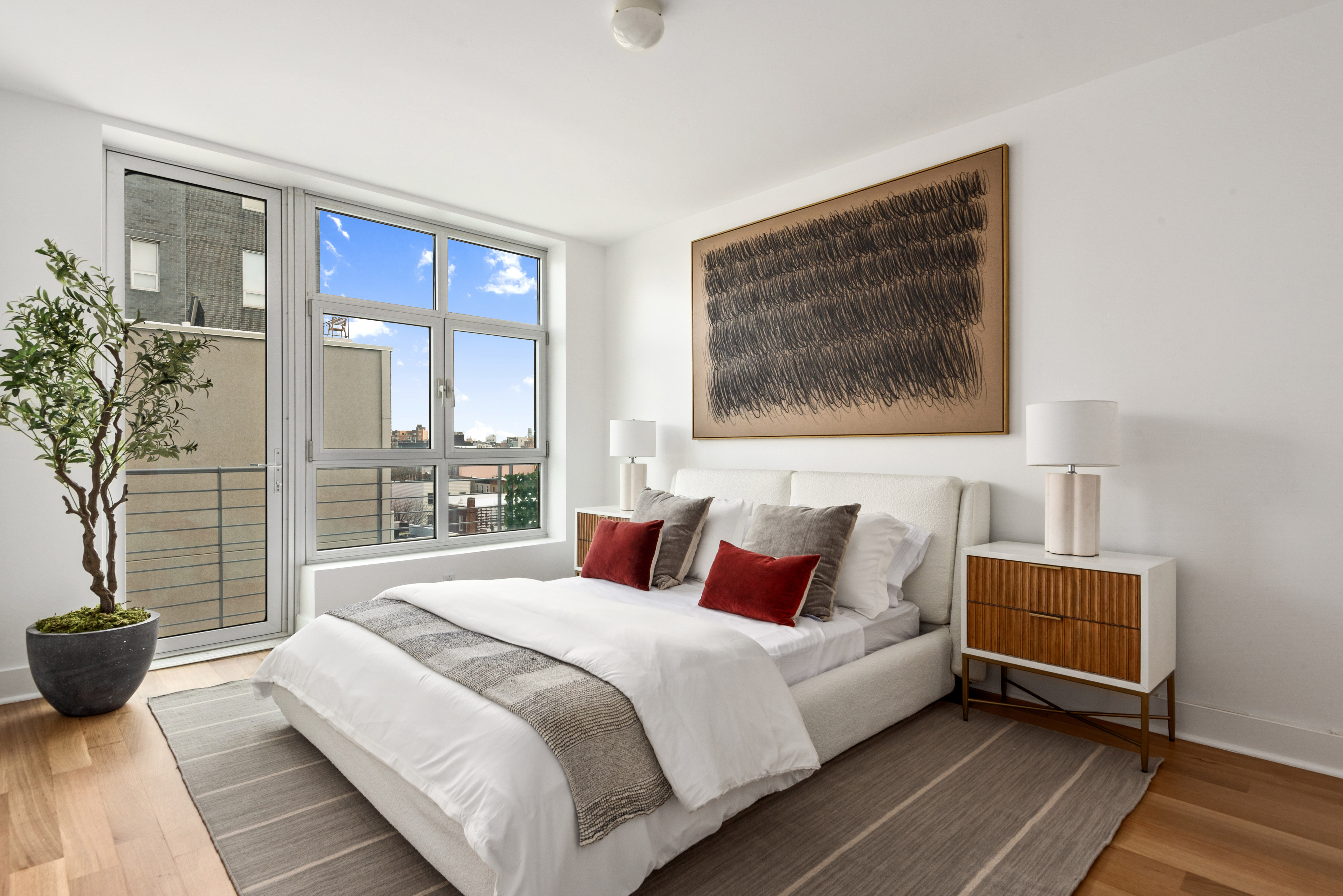 460 Manhattan Avenue, Unit PHB Brooklyn, NY 11222 - Photo 8 of 16 a bedroom with a large bed and a large window