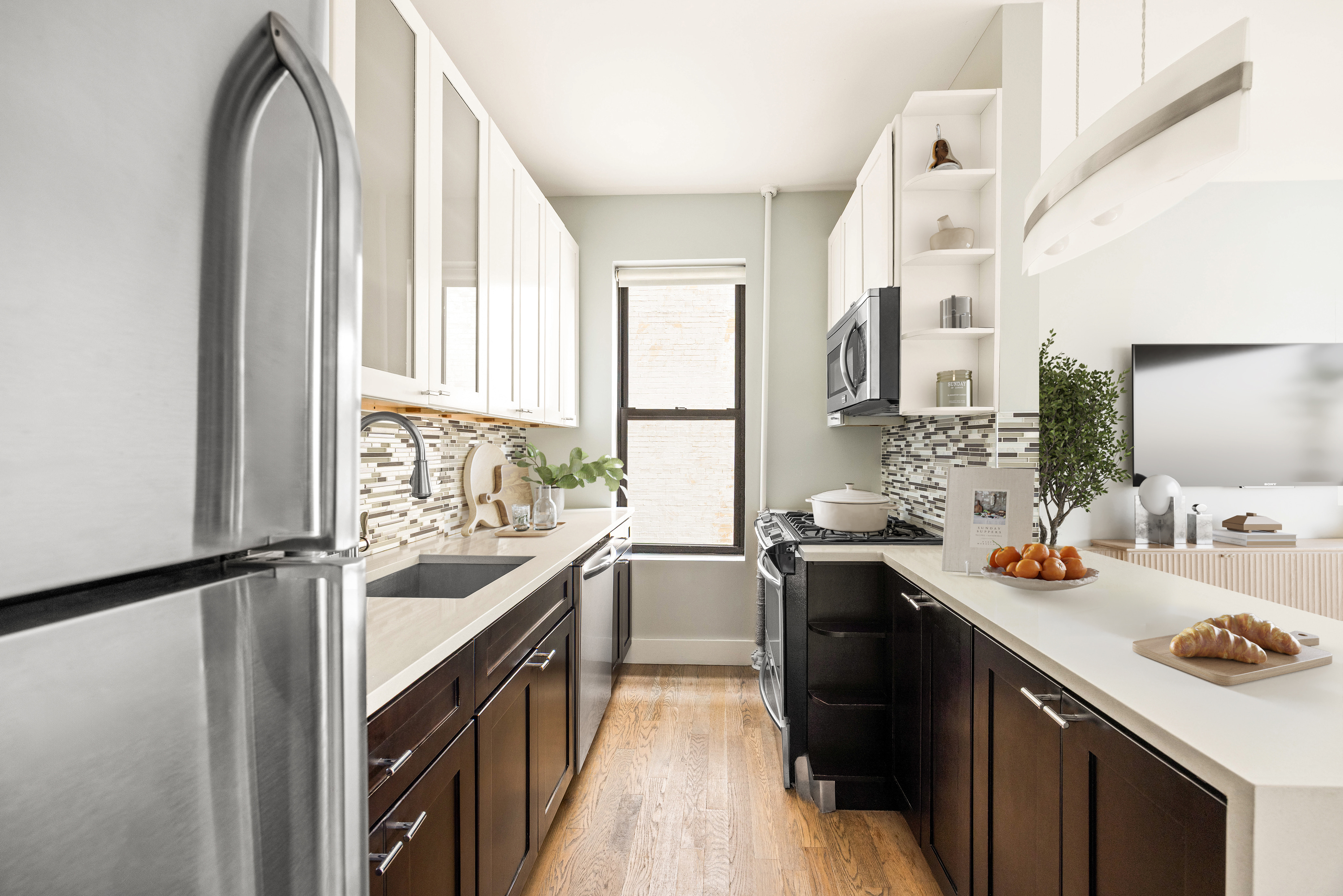 839 East 19th Street, Unit 2D Brooklyn, NY 11230 - Photo 3 of 10 a kitchen with a sink stove and cabinets