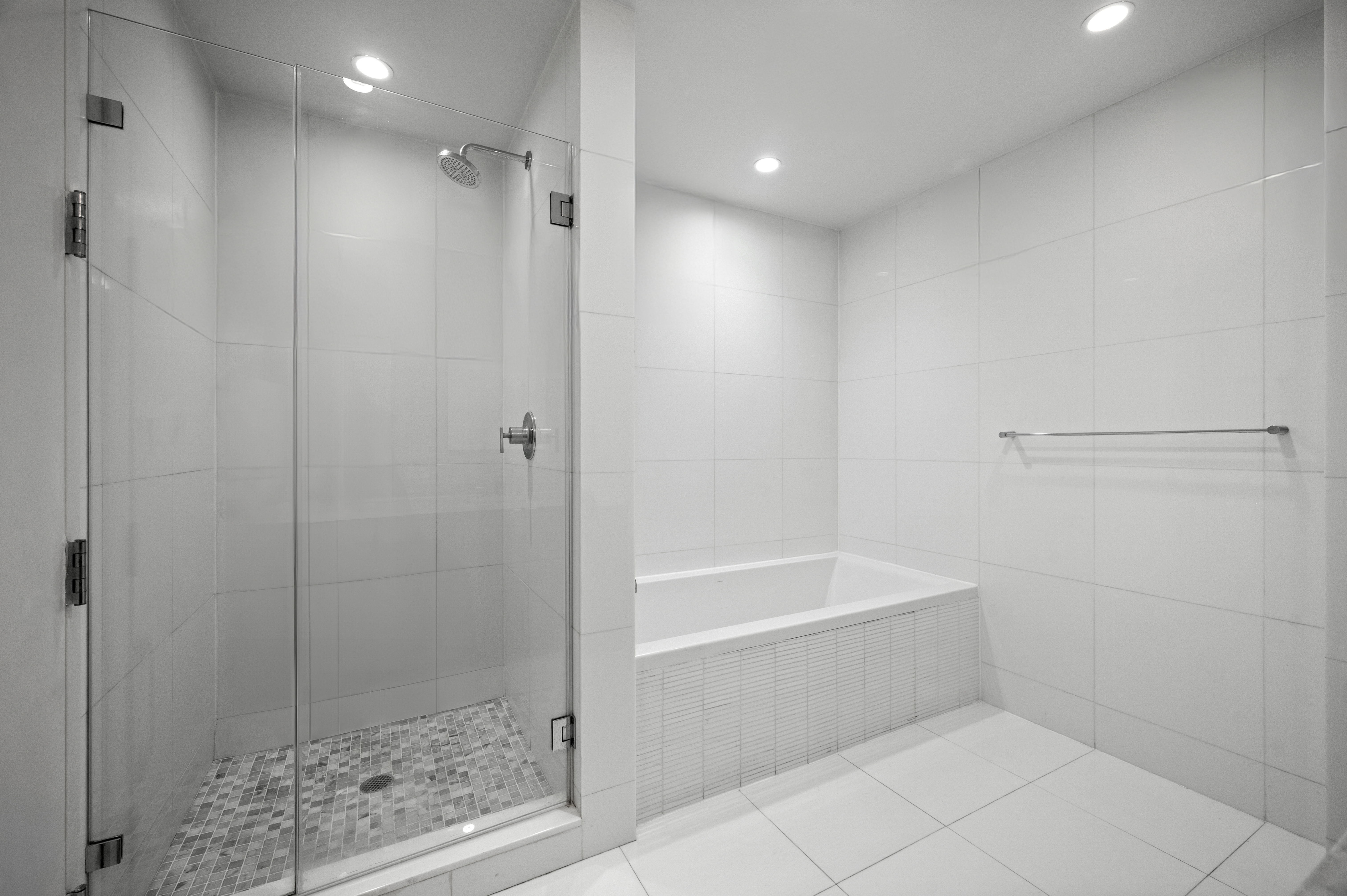 117 West 123rd Street, Unit 5D Manhattan, NY 10027 - Photo 9 of 18 a bathroom with a bathtub and a shower