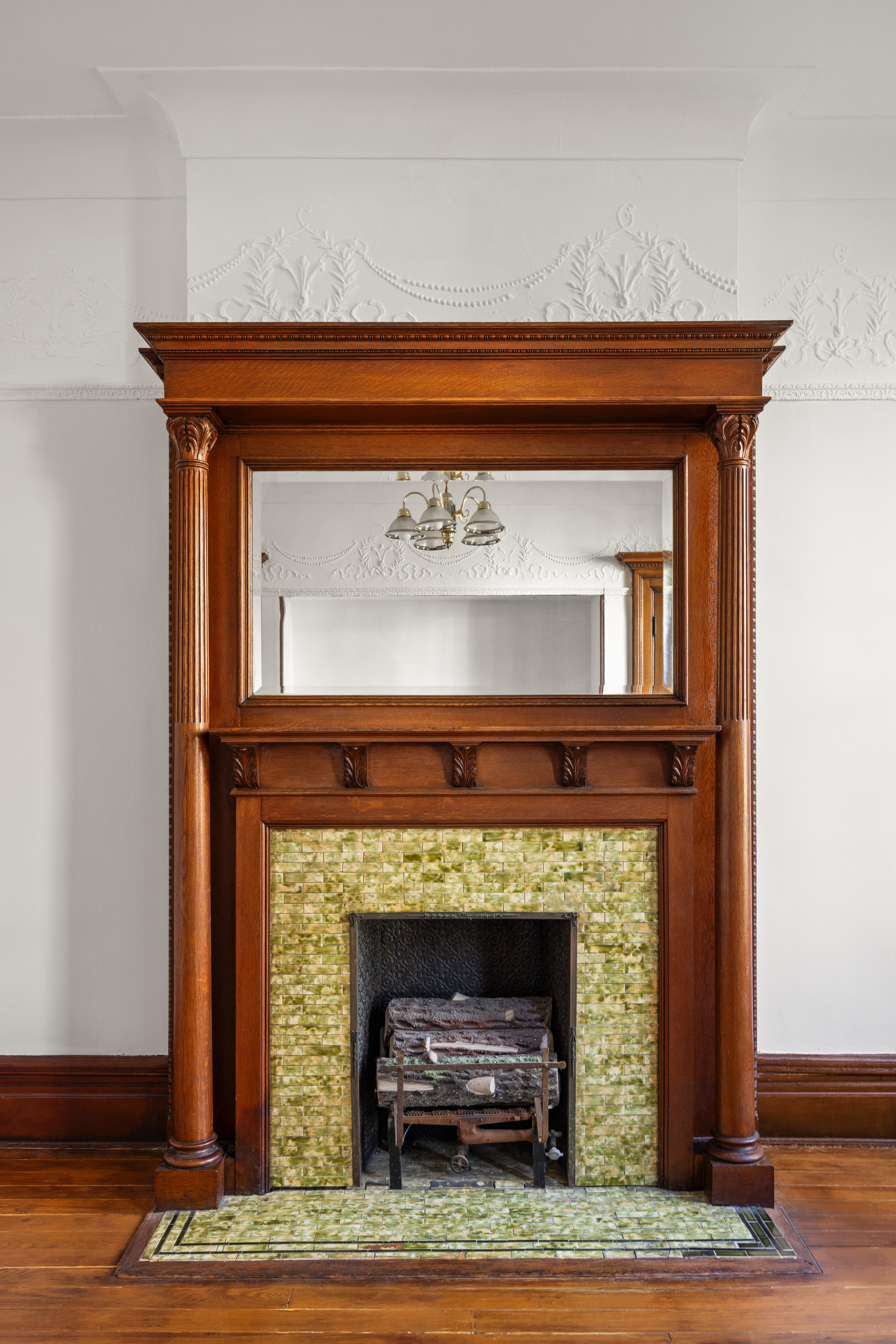 415 5th Street, Unit 1 Brooklyn, NY 11215 - Photo 5 of 14 a fireplace with a clock on top of it