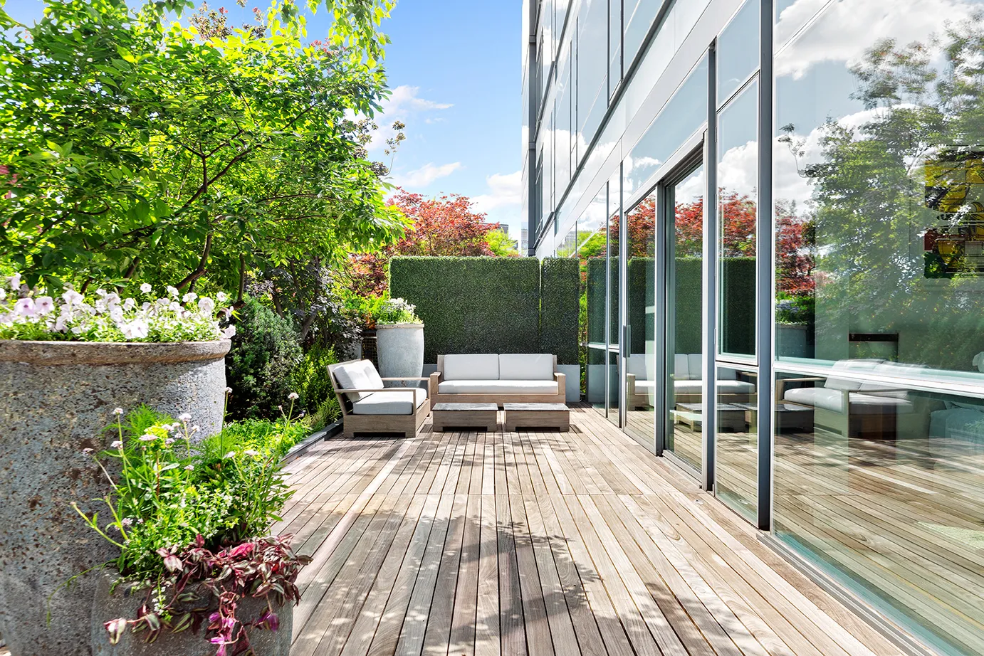 a view of a chairs and table on the wooden deck