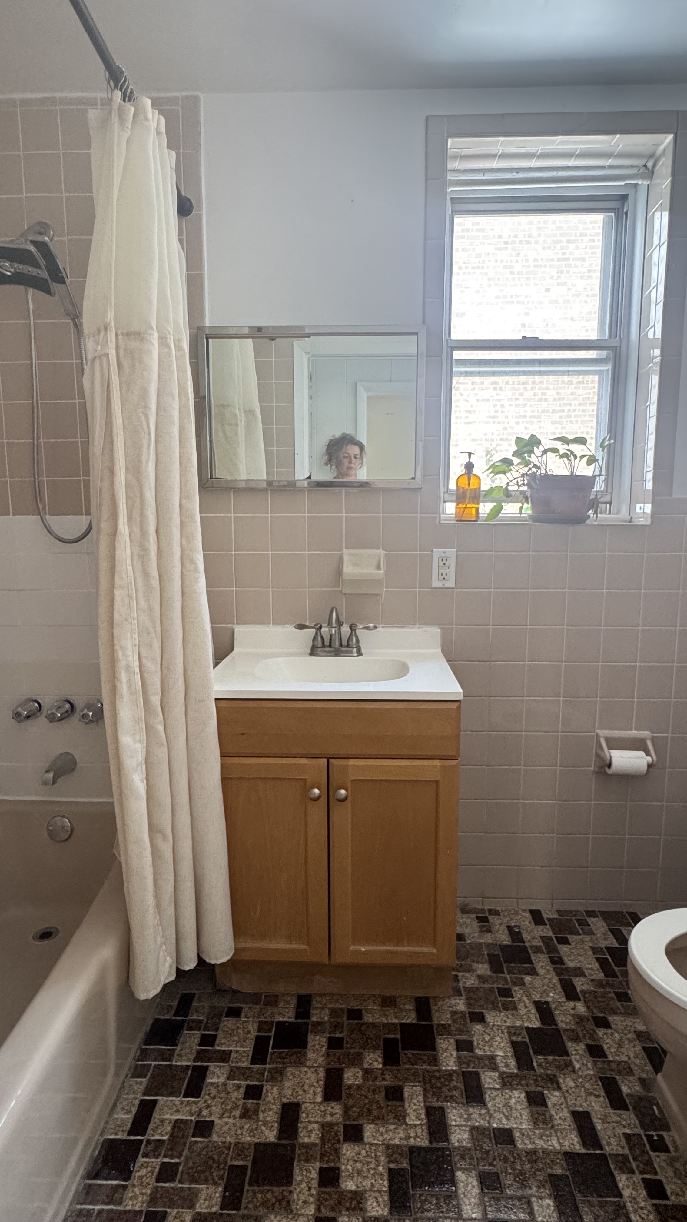 196 Seeley Street, Unit 2 Brooklyn, NY 11218 - Photo 7 of 7 a bathroom with a sink a toilet and shower