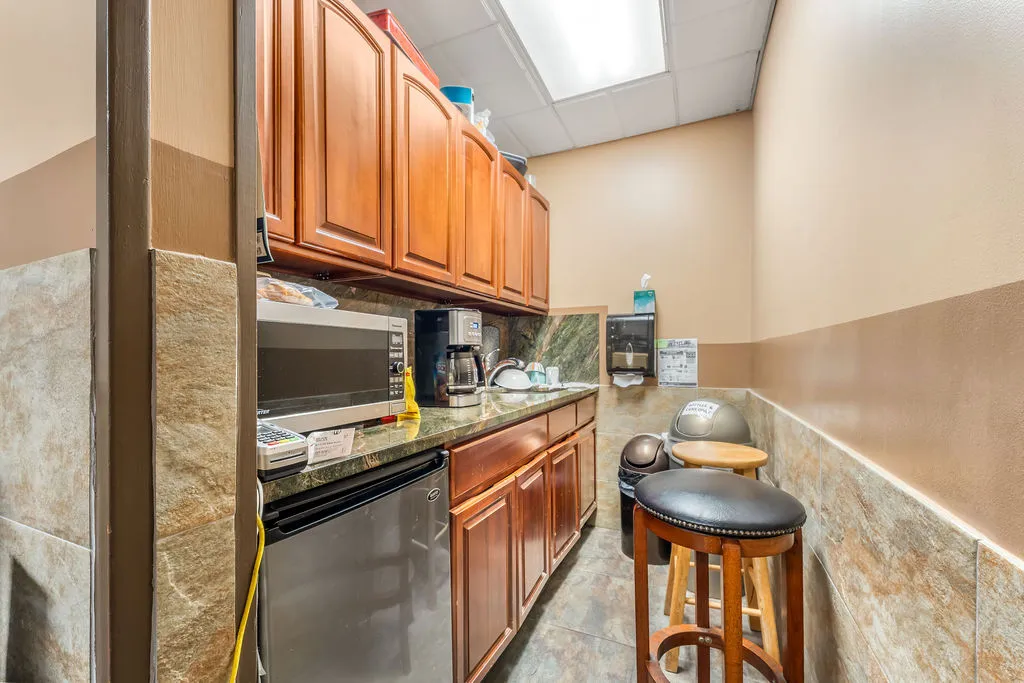 a storage room with water heater and racks