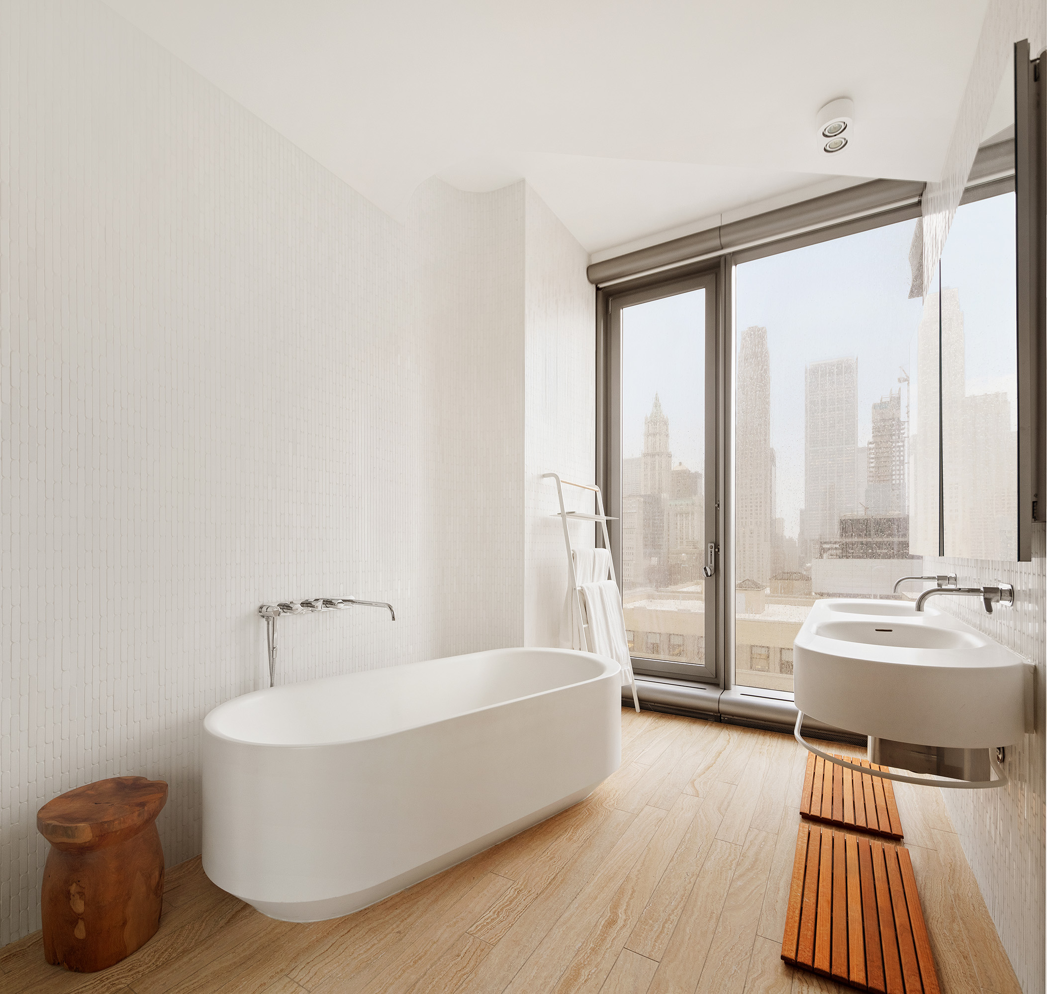 56 Leonard Street, Unit 21AWEST Manhattan, NY 10013 - Photo 5 of 11 a bathroom with a bathtub and a sink