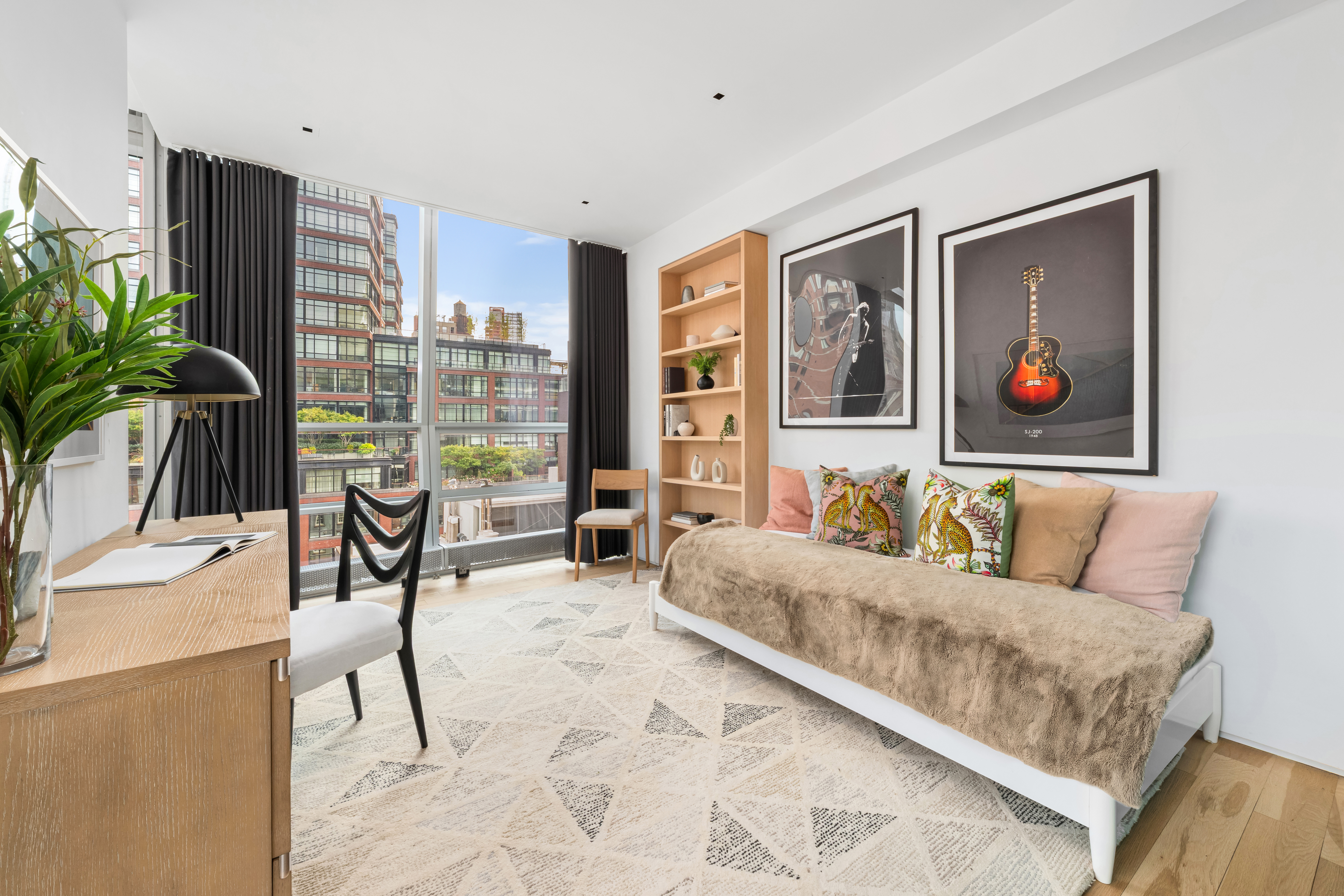 166 Perry Street, Unit 6B Manhattan, NY 10014 - Photo 7 of 14 a living room with furniture and a large window with potted plants
