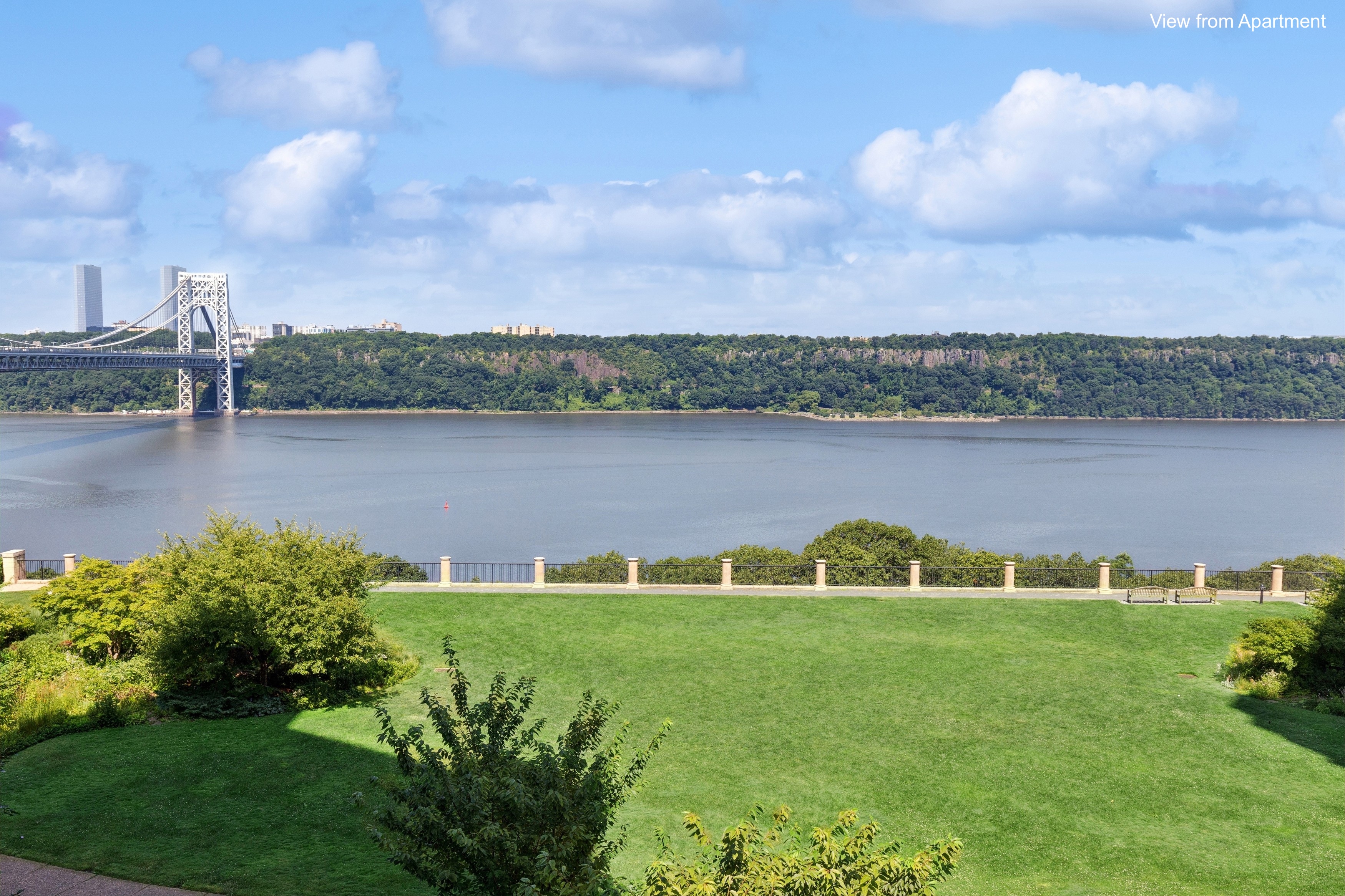 120 Cabrini Boulevard, Unit 48 Manhattan, NY 10033 - Photo 2 of 23 a view of a lake with houses in the back