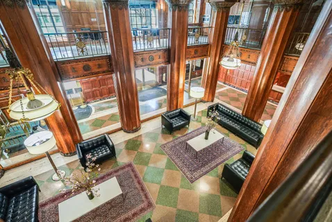 a picture of a bench in front of a window