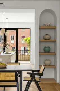 a view of a workspace room with a window