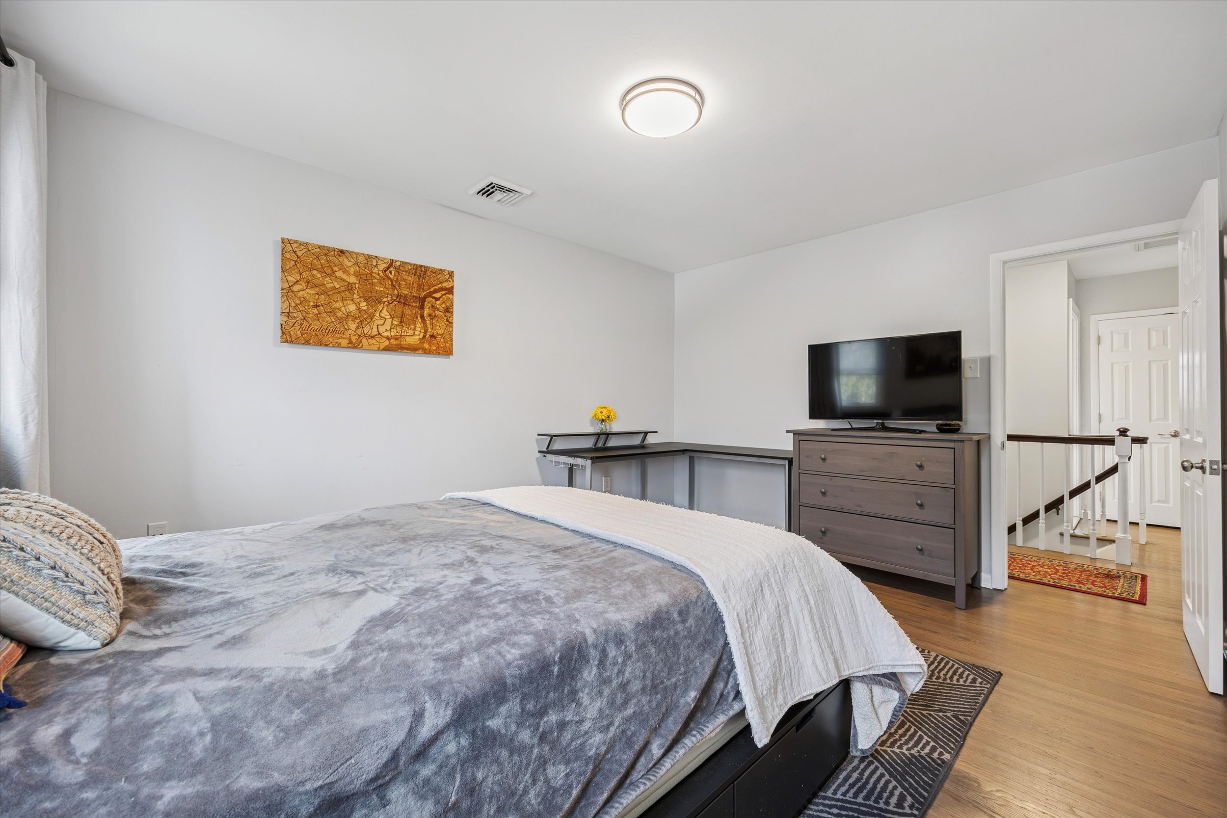 535 Bell Lane Ambler, PA 19002 - Photo 27 of 45 a bedroom with a bed and flat screen tv