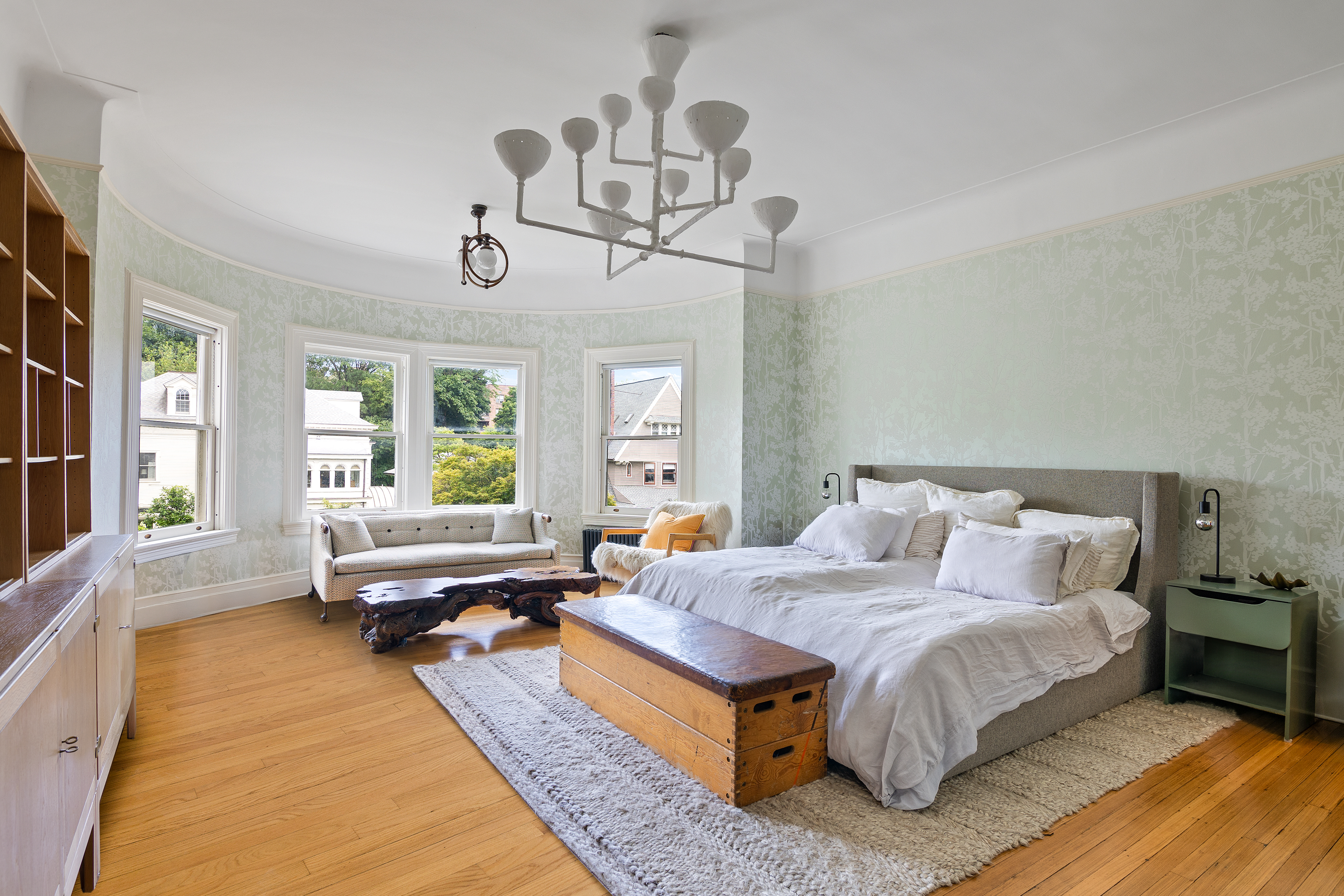 1440 Albemarle Road Brooklyn, NY 11226 - Photo 17 of 39 a spacious bedroom with a bed a chandelier and large window