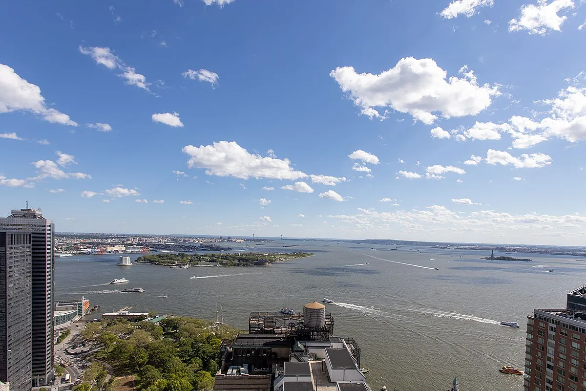 20 West Street, Unit 28F Manhattan, NY 10004 - Photo 17 of 18 a view of a lake and mountain