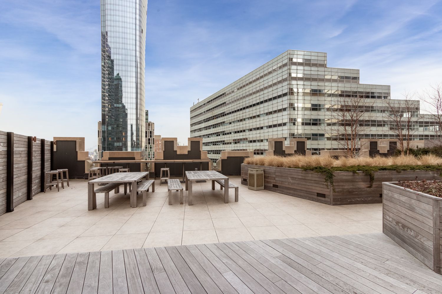 100 Barclay Street, Unit 17J Manhattan, NY 10007 - Photo 11 of 18 a view of roof deck with outdoor seating and city view