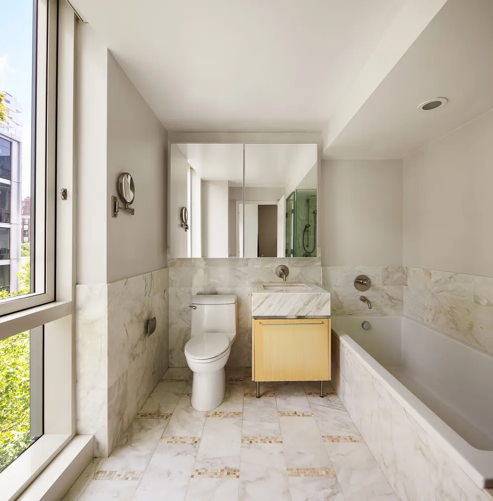 a bathroom with a sink a toilet and bathtub