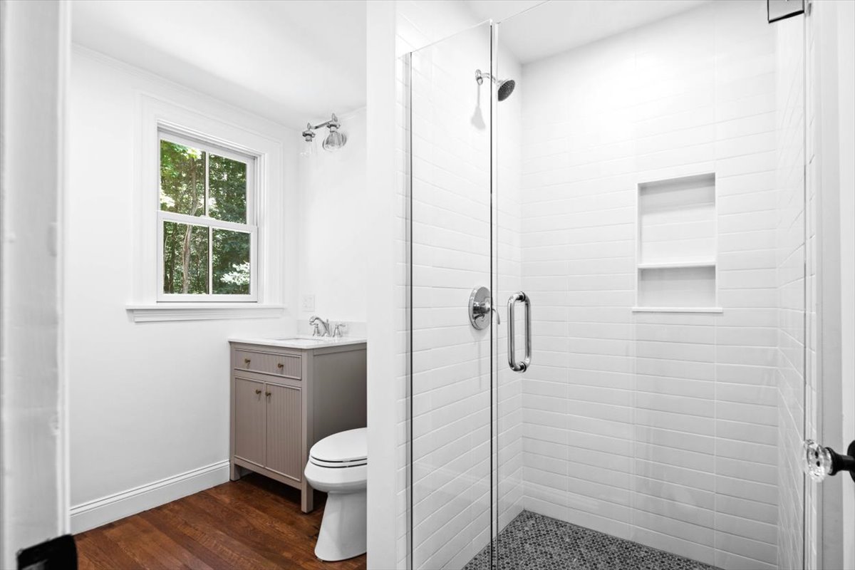 49 Garrison Road Hingham, MA 02043 - Photo 15 of 30 a bathroom with a toilet sink and shower