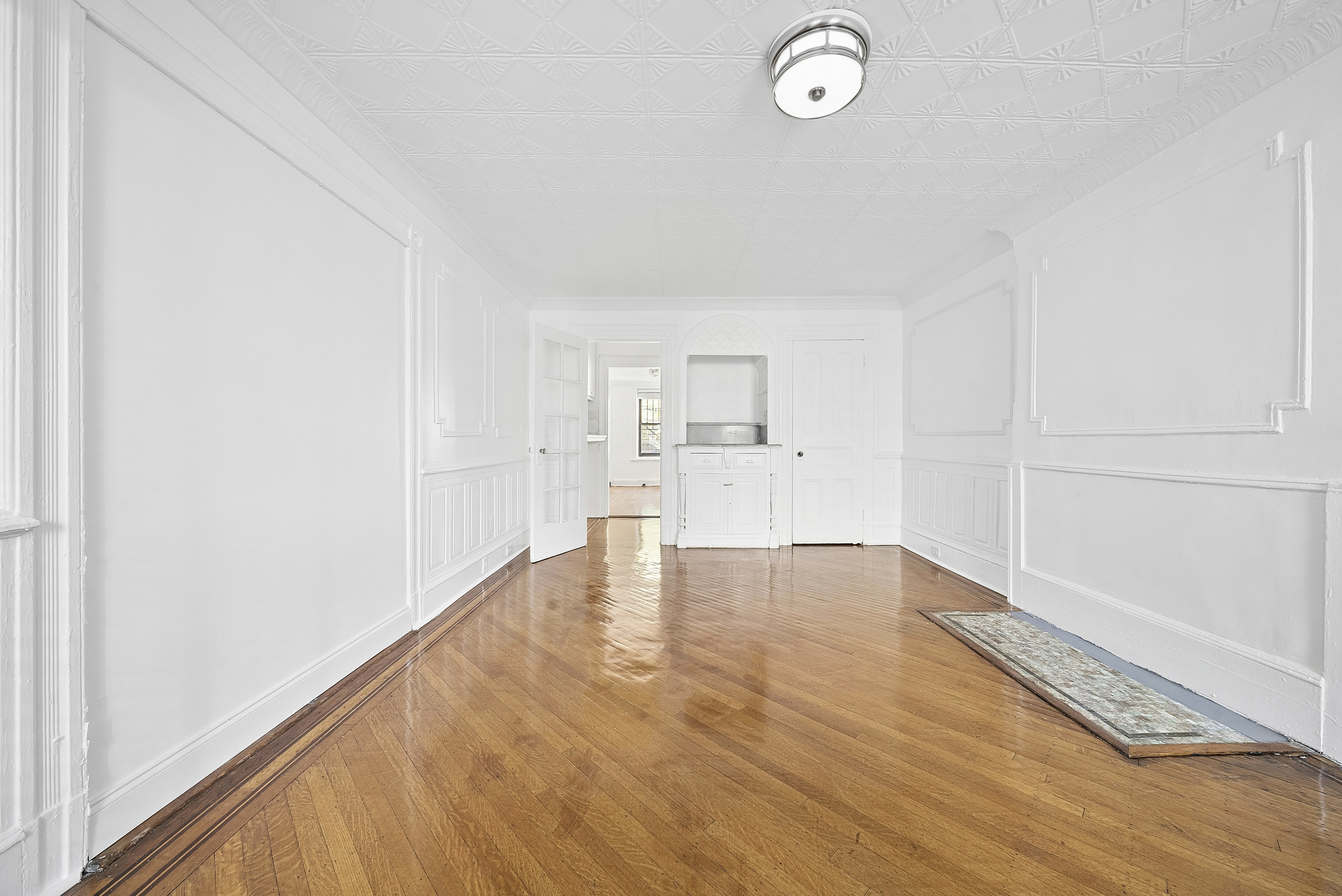 490 A Monroe Street, Unit apt.1 Brooklyn, NY 11221 - Photo 8 of 12 a view of empty room with wooden floor