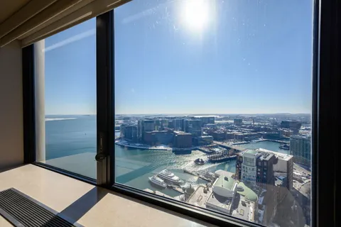 a view of a balcony with a floor to ceiling window
