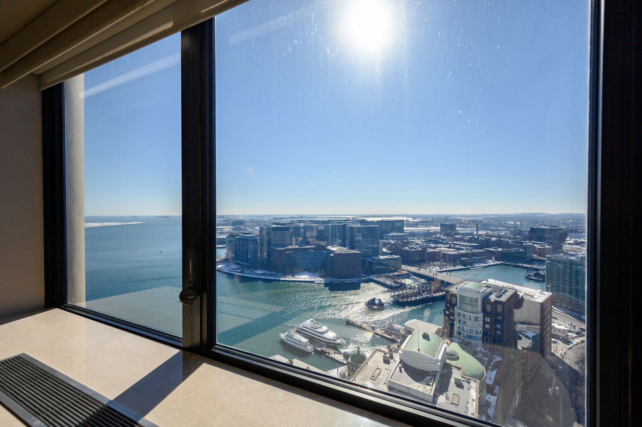 65 East India Row, Unit 38 F/G Boston, MA 02110 - Photo 11 of 32 a view of a balcony with a floor to ceiling window