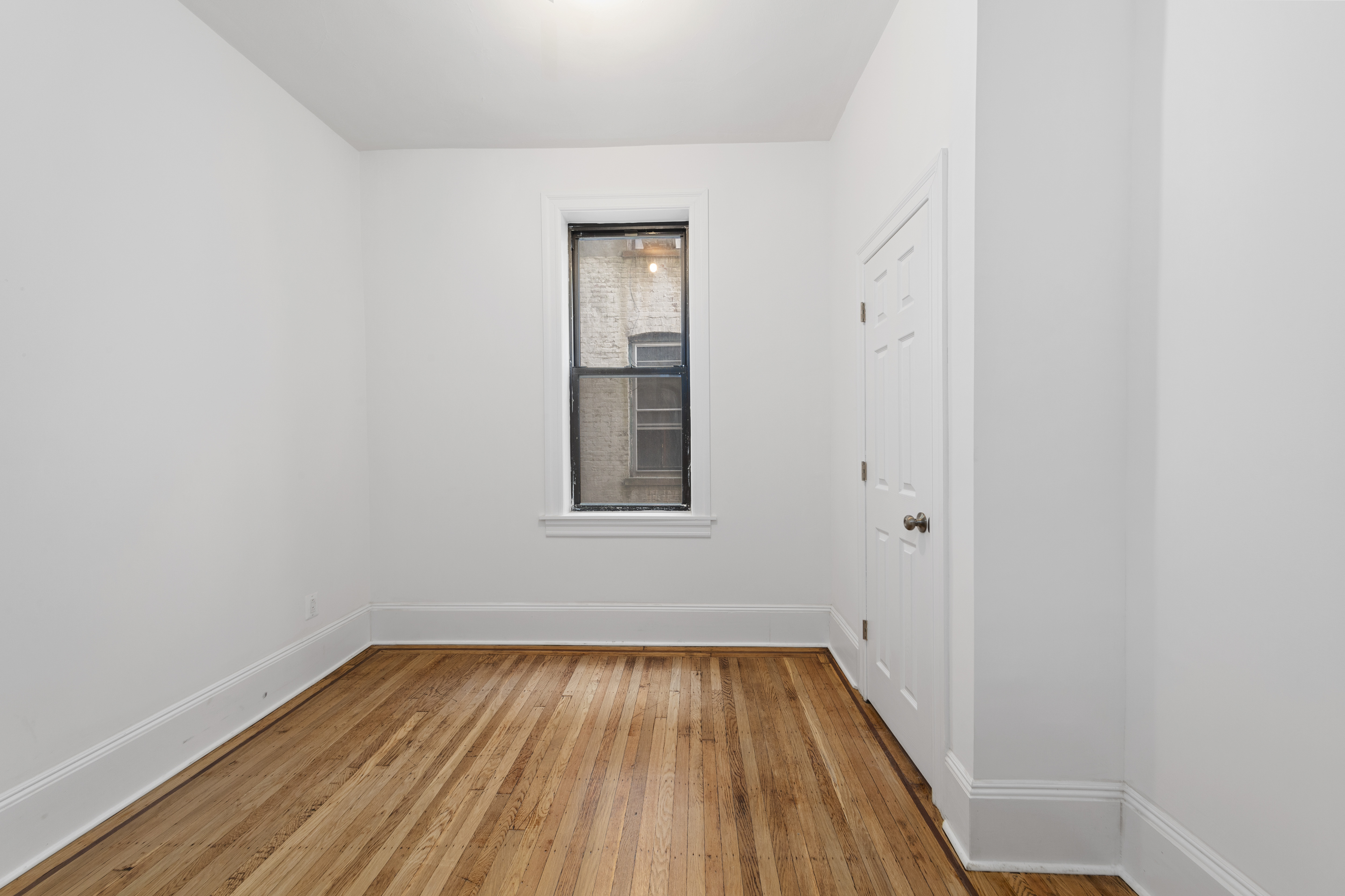 172 Prospect Park West, Unit 3L Brooklyn, NY 11215 - Photo 6 of 10 a view of a room with wooden floor and window