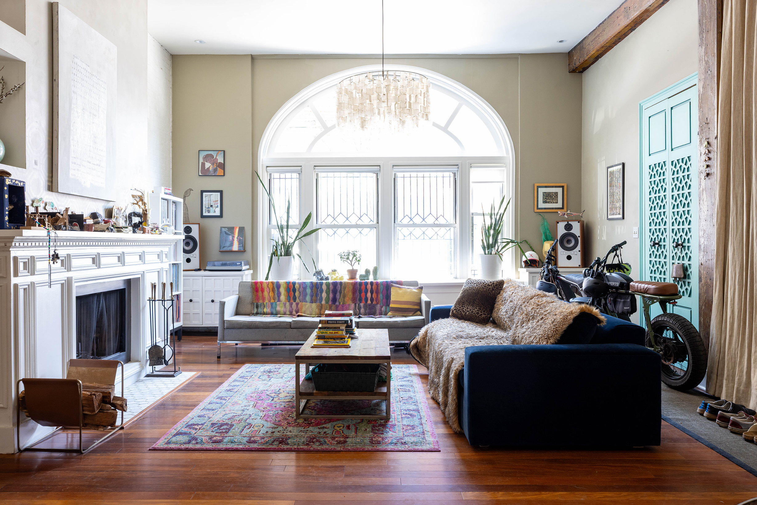 a living room with furniture and a fireplace