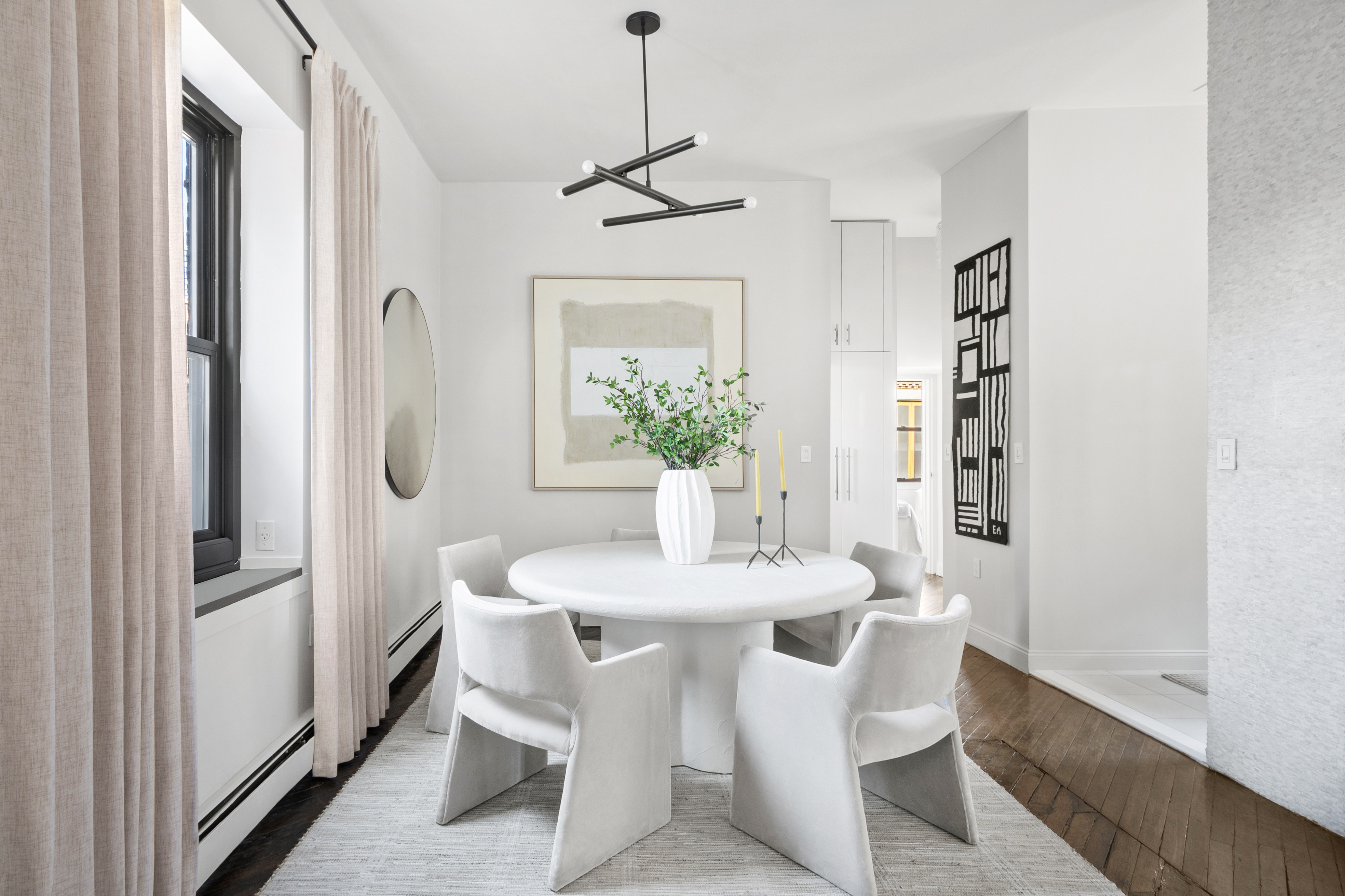 454 West 46th Street, Unit 5CS Manhattan, NY 10036 - Photo 5 of 25 a dining room with furniture and window