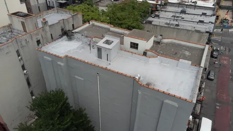 an aerial view of a house with yard