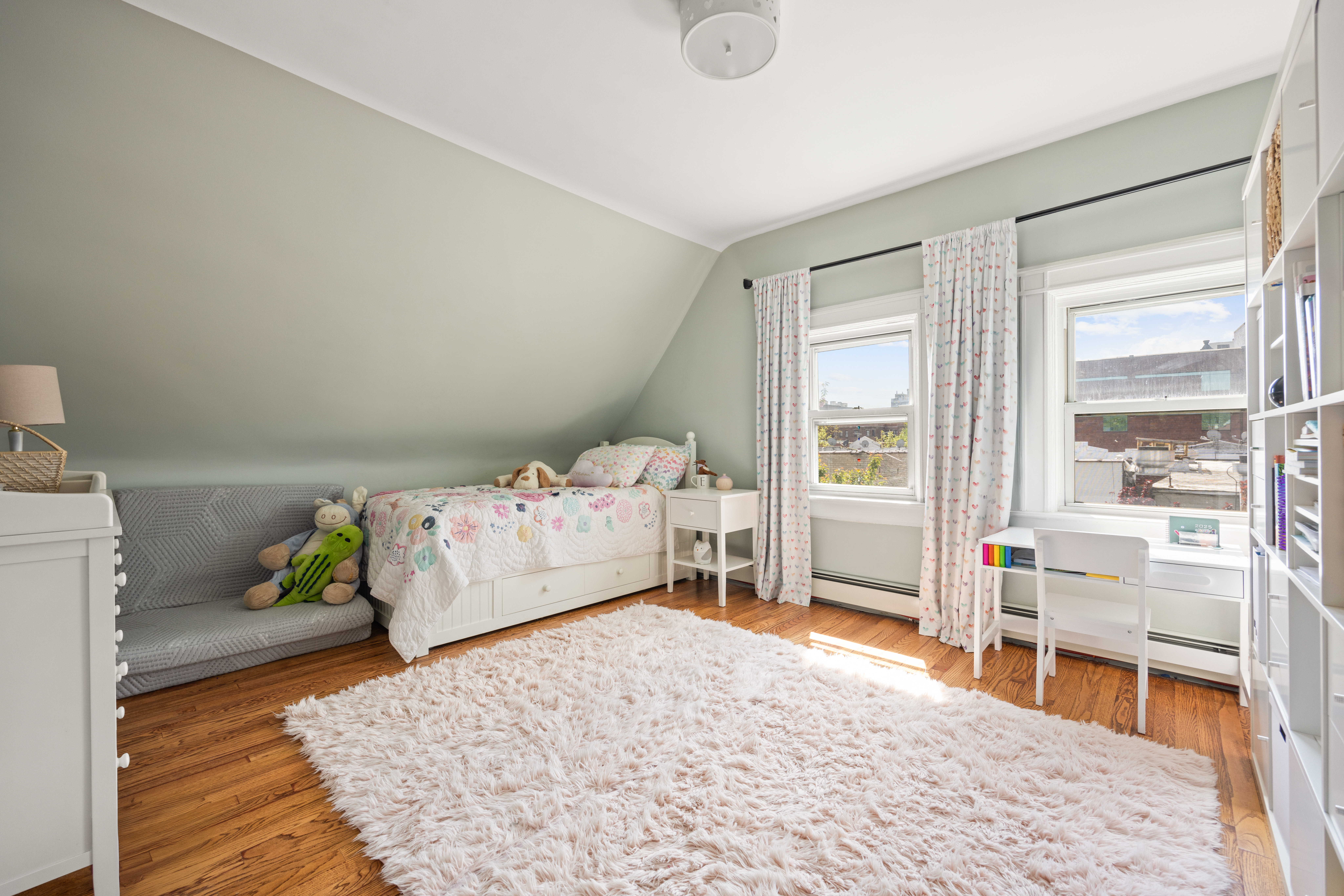 758 Westminster Road Brooklyn, NY 11230 - Photo 18 of 32 a bedroom with a bed and a wooden floor