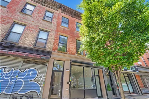 a view of a street in front of a building