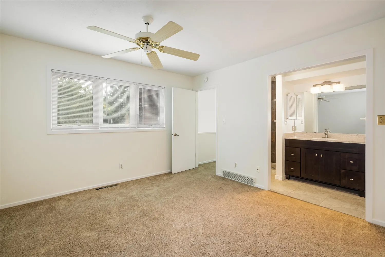 a view of an empty room with a bathroom