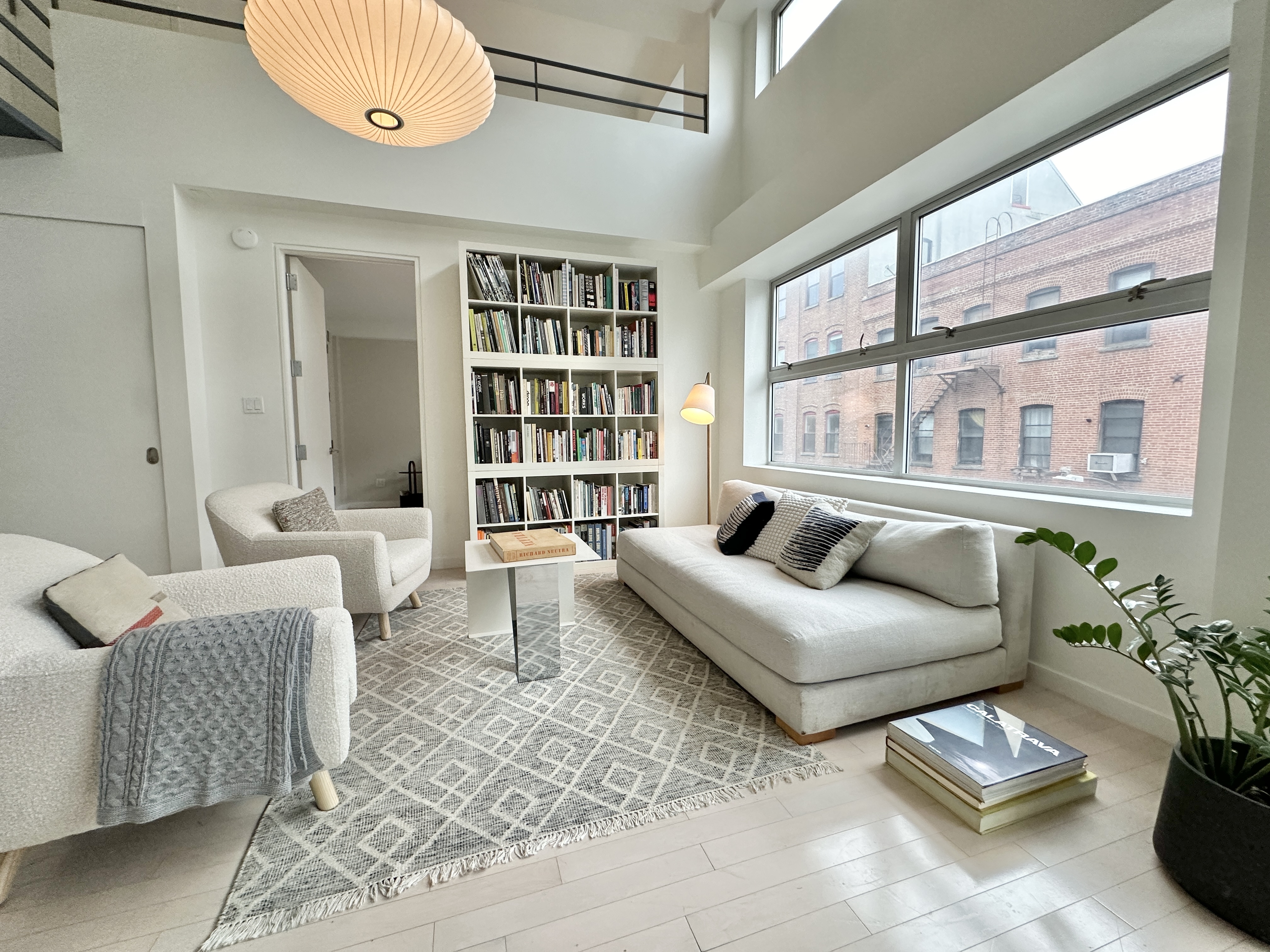 100 North 3rd Street, Unit 3E Brooklyn, NY 11249 - Photo 3 of 15 a living room with furniture and a large window