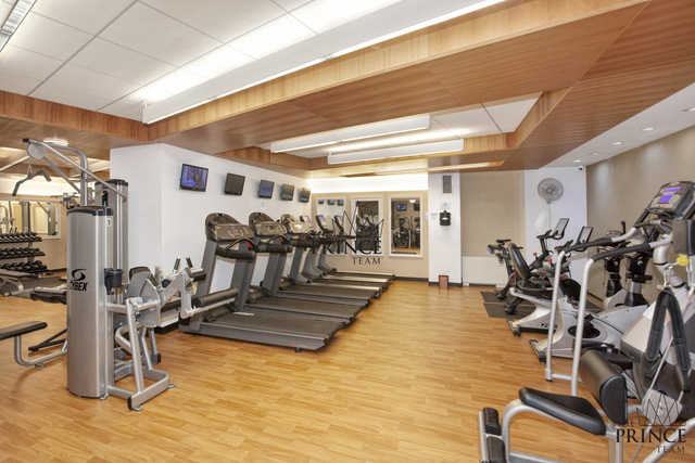 99 John Street, Unit 208 Manhattan, NY 10038 - Photo 8 of 18 a view of a room with gym equipment