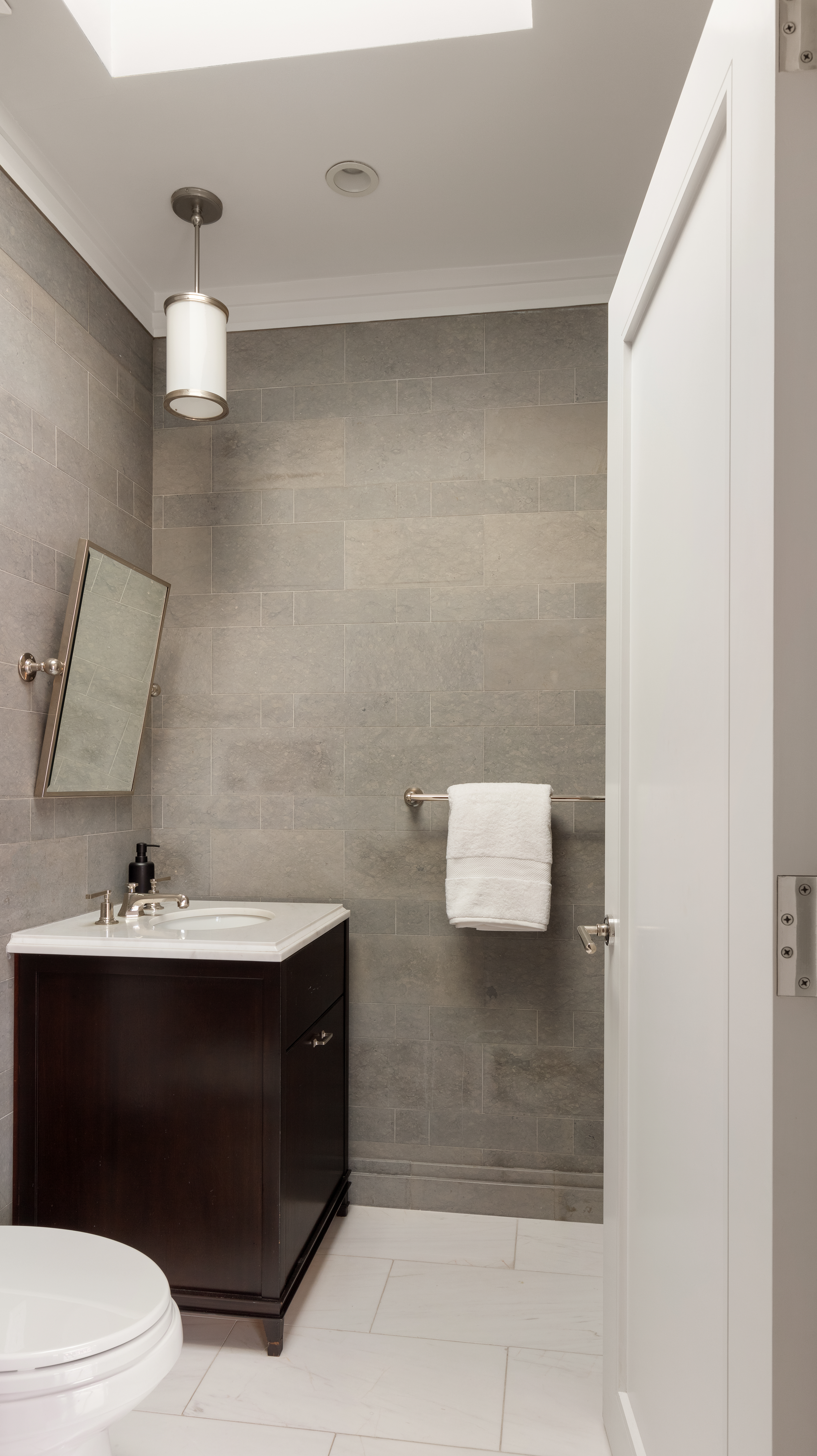 31 West 11th Street Manhattan, NY 10011 - Photo 15 of 21 a bathroom with a sink a toilet and mirror