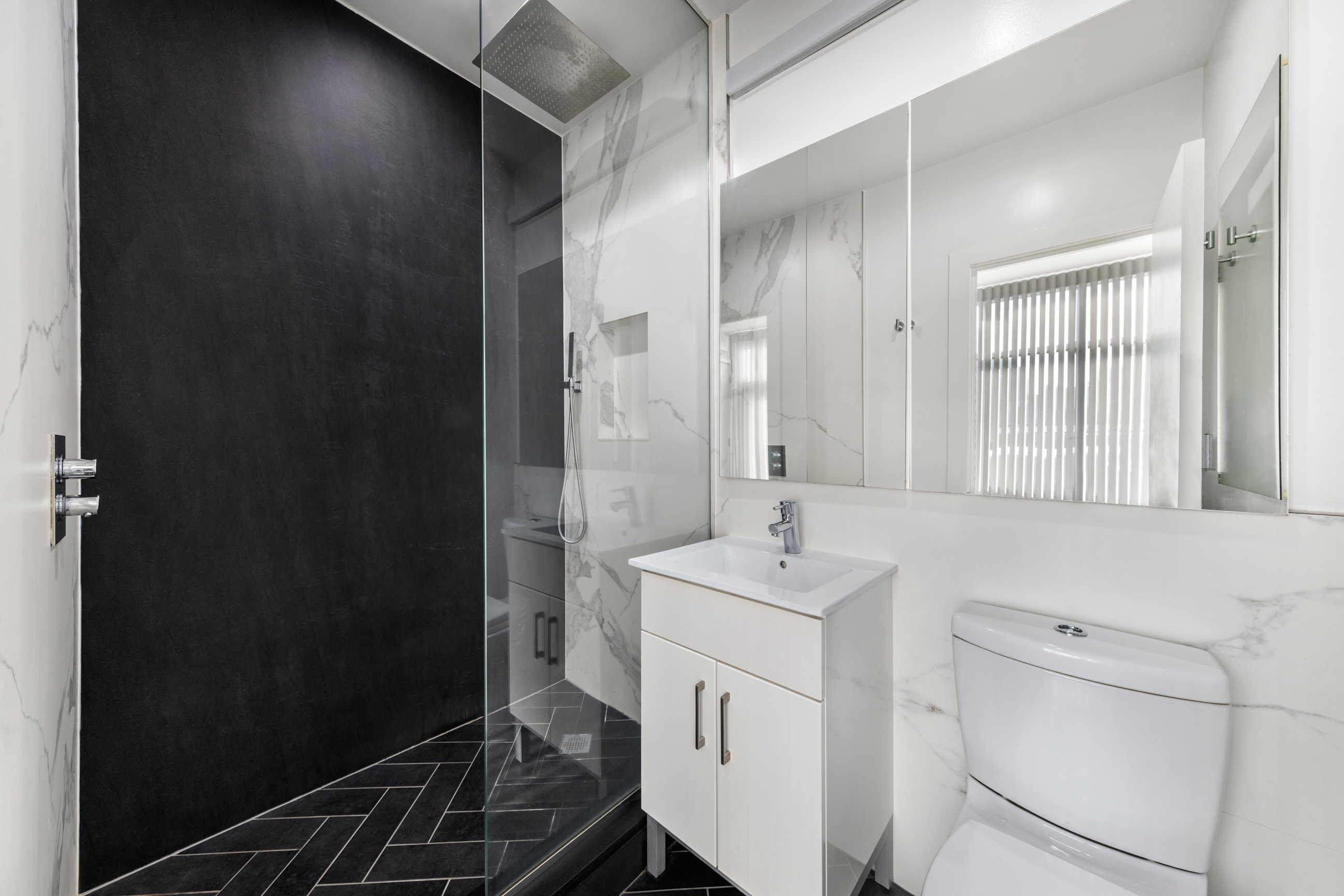 311 West 76th Street, Unit PH-5 Manhattan, NY 10023 - Photo 7 of 11 a bathroom with a sink a toilet and shower