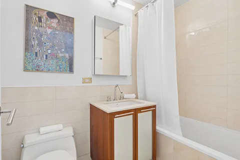 a bathroom with a sink a toilet and a bathtub