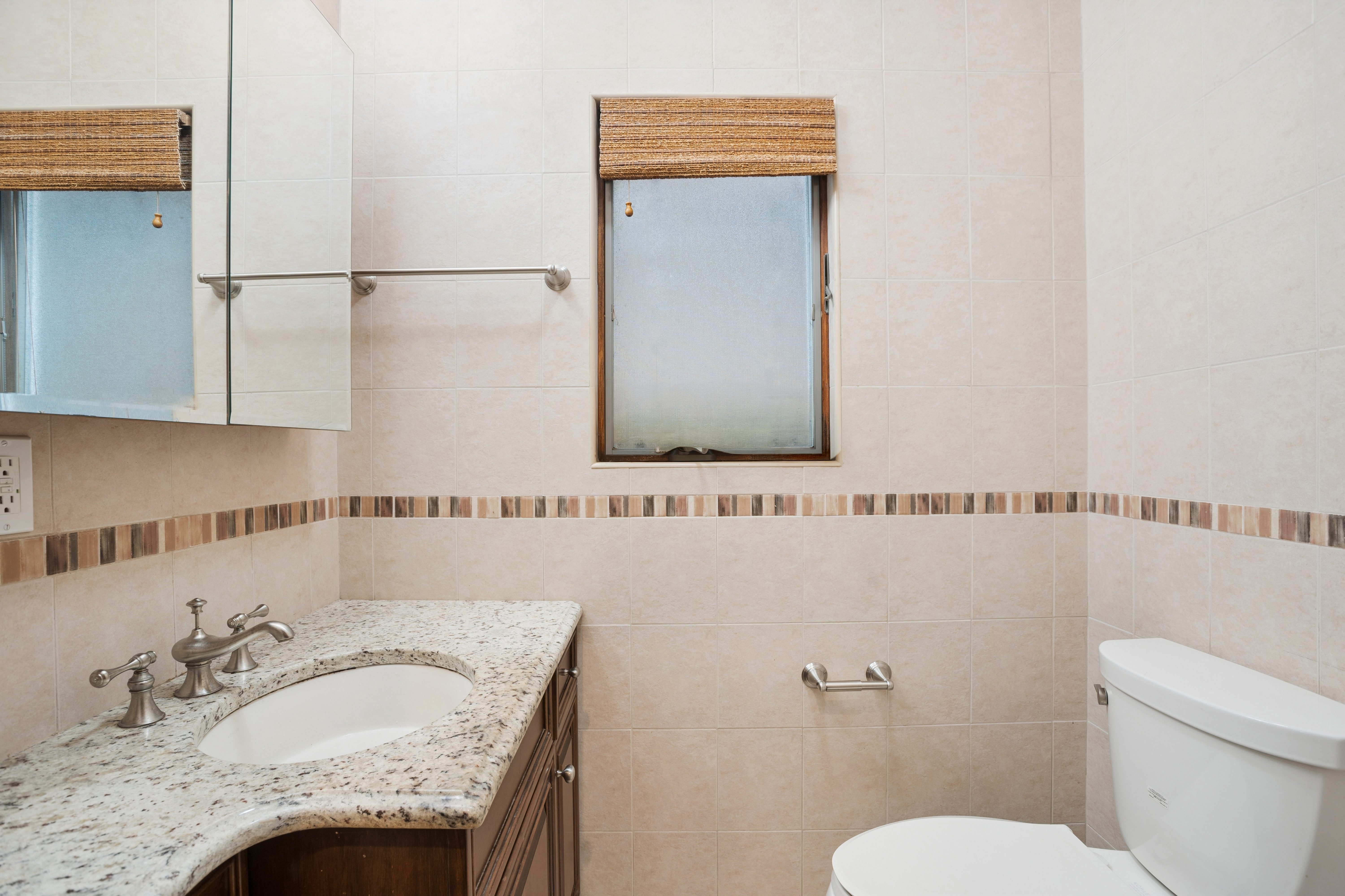 1982 East 23rd Street Brooklyn, NY 11229 - Photo 13 of 16 a bathroom with a granite countertop sink and a mirror