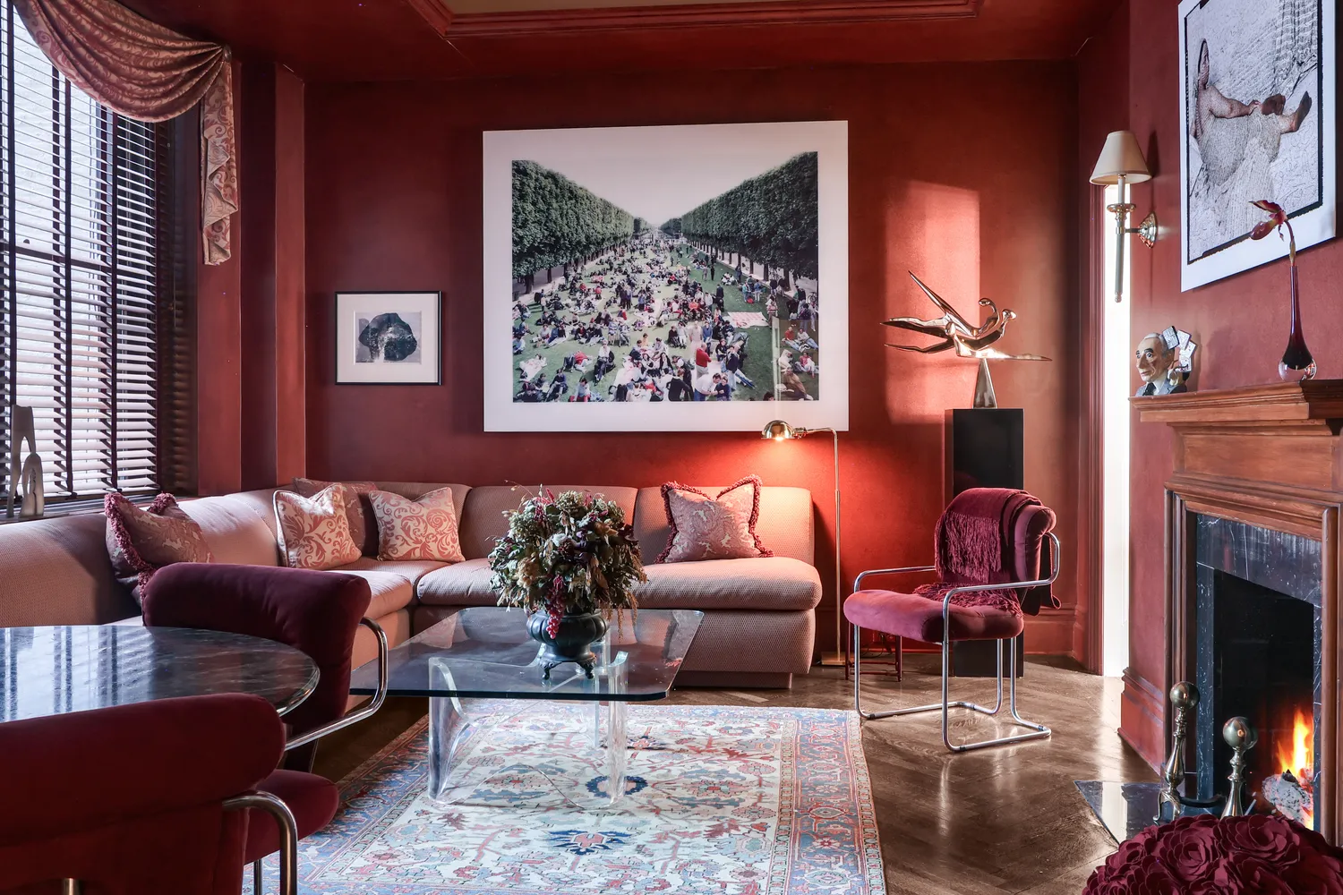 a living room with furniture a rug and a fireplace