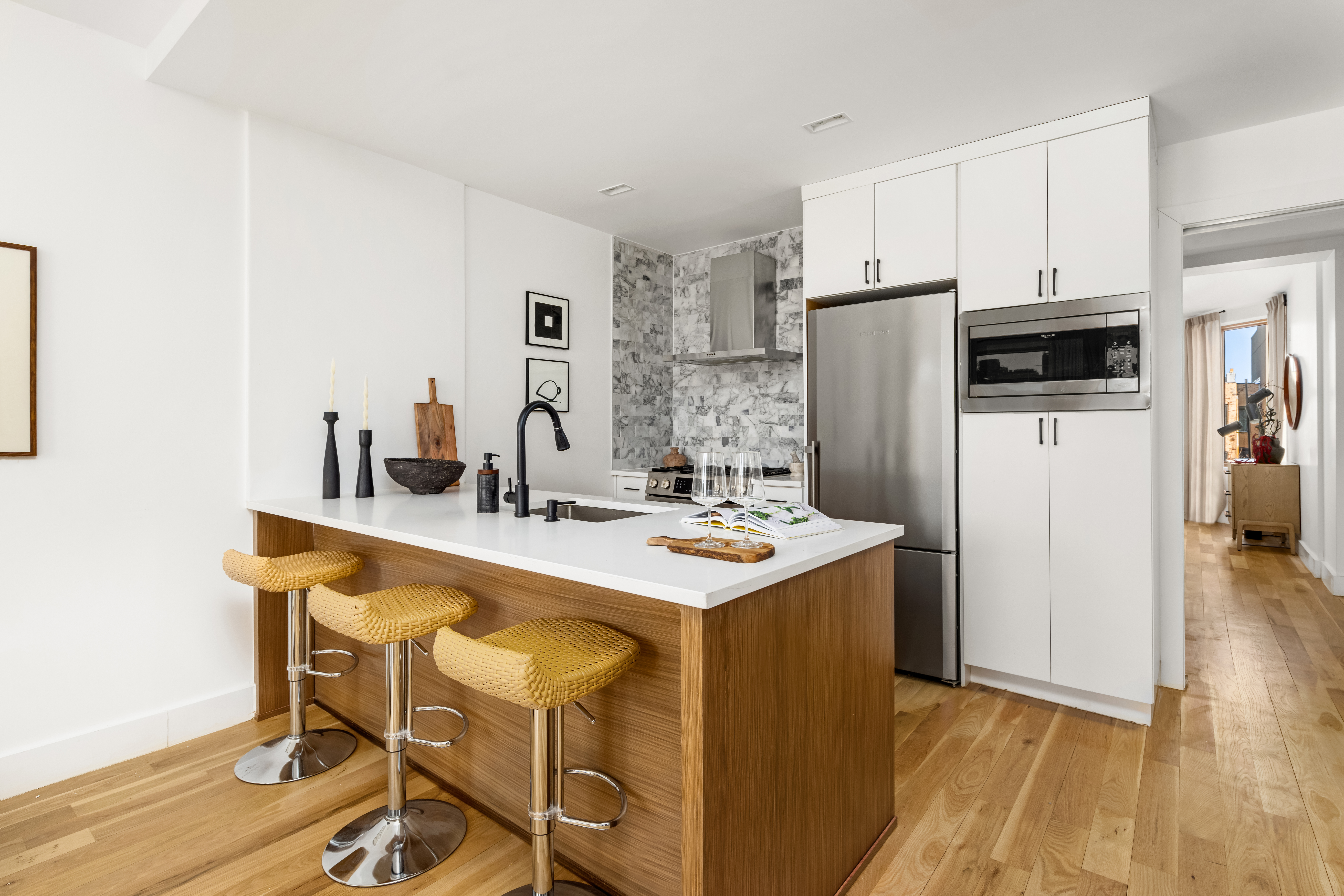 529 Park Place, Unit 401 Brooklyn, NY 11238 - Photo 3 of 13 a kitchen with stainless steel appliances a stove a sink and a refrigerator