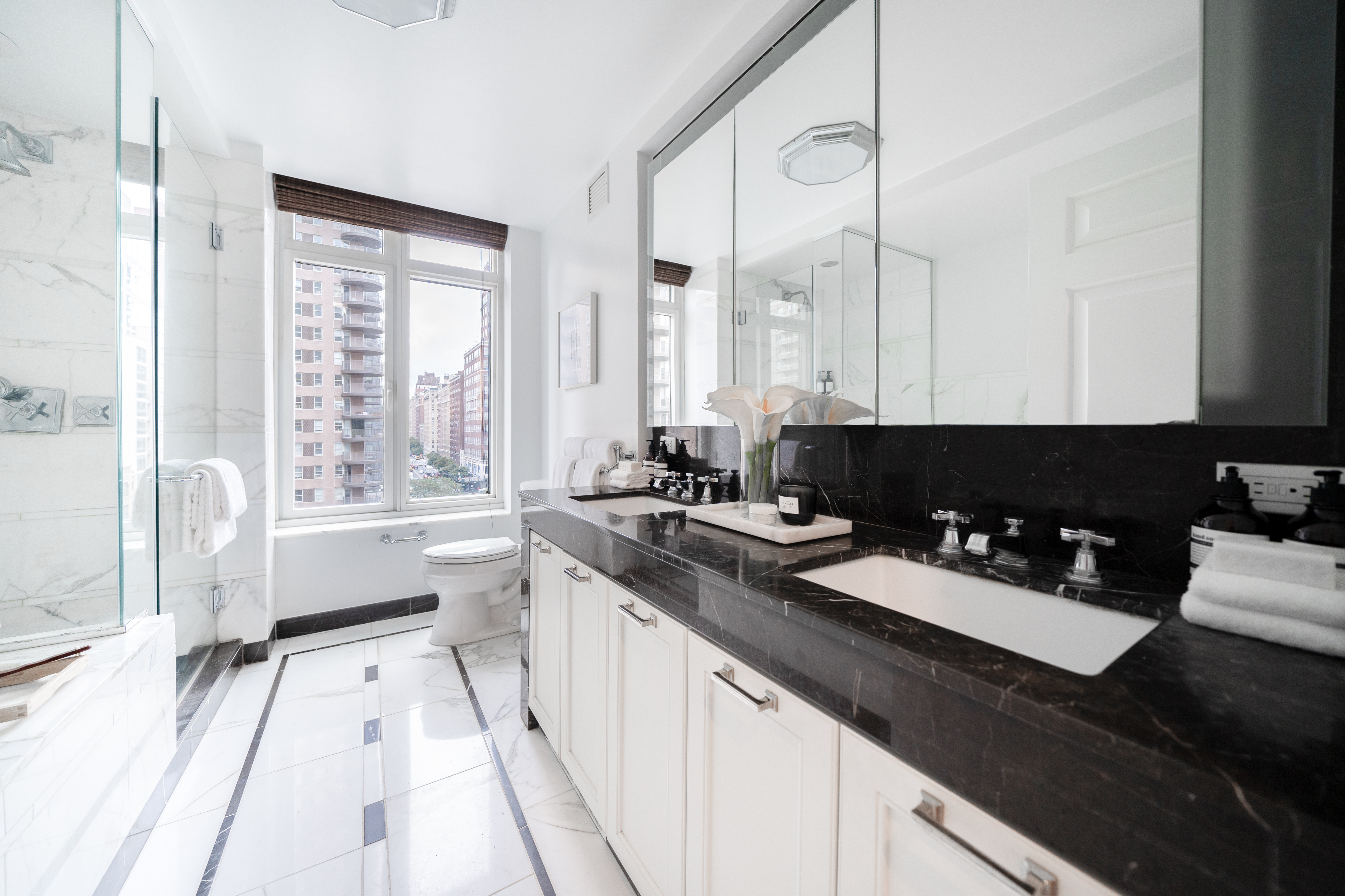 205 East 85th Street, Unit G10 Manhattan, NY 10028 - Photo 14 of 27 a kitchen with a sink and large window