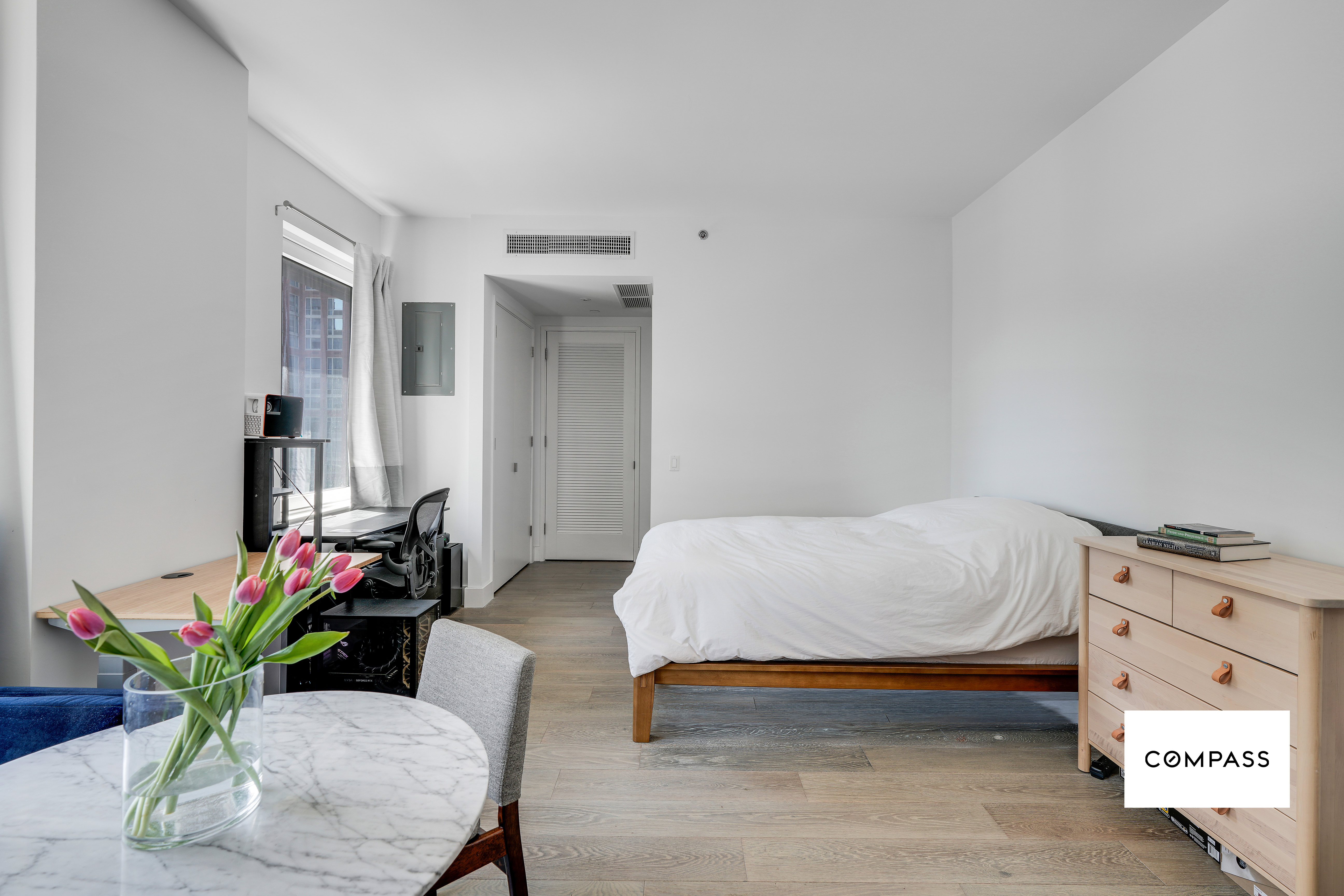 10 Nevins Street, Unit 14E Brooklyn, NY 11217 - Photo 4 of 11 a bedroom with furniture and a potted plant