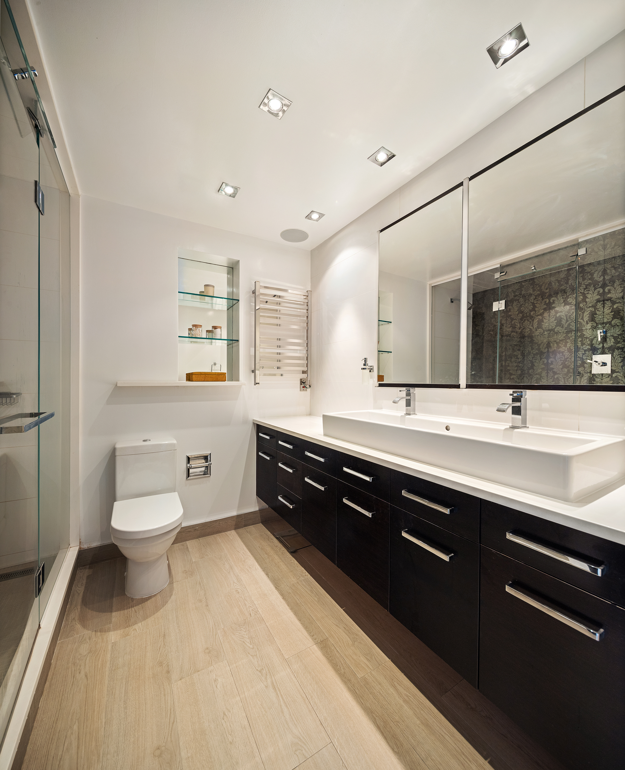 167 Perry Street, Unit 4NQ Manhattan, NY 10014 - Photo 11 of 20 a spacious bathroom with a double vanity sink toilet and a tub