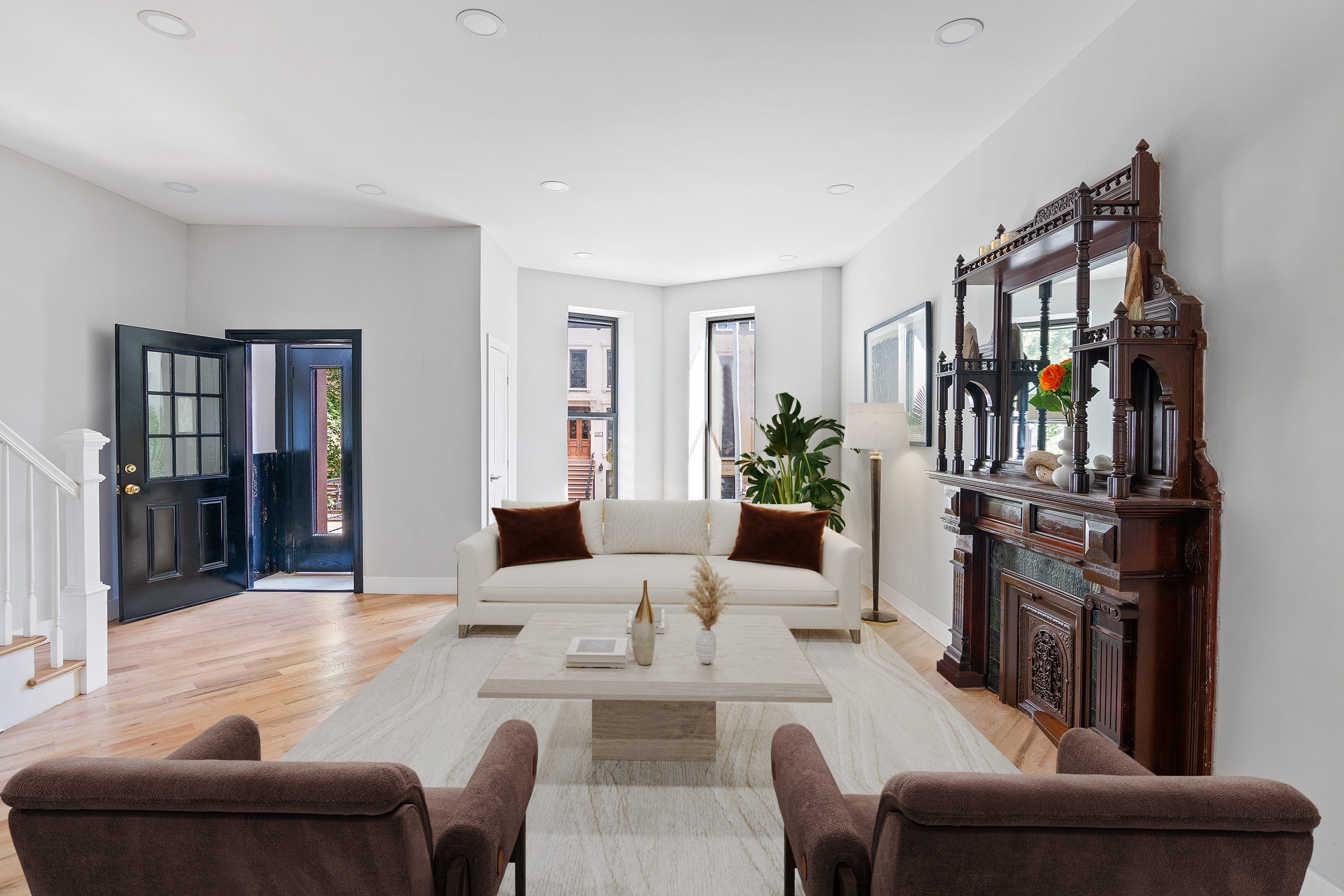 497 Madison Street Brooklyn, NY 11221 - Photo 1 of 19 a living room with furniture a bookshelf and a window