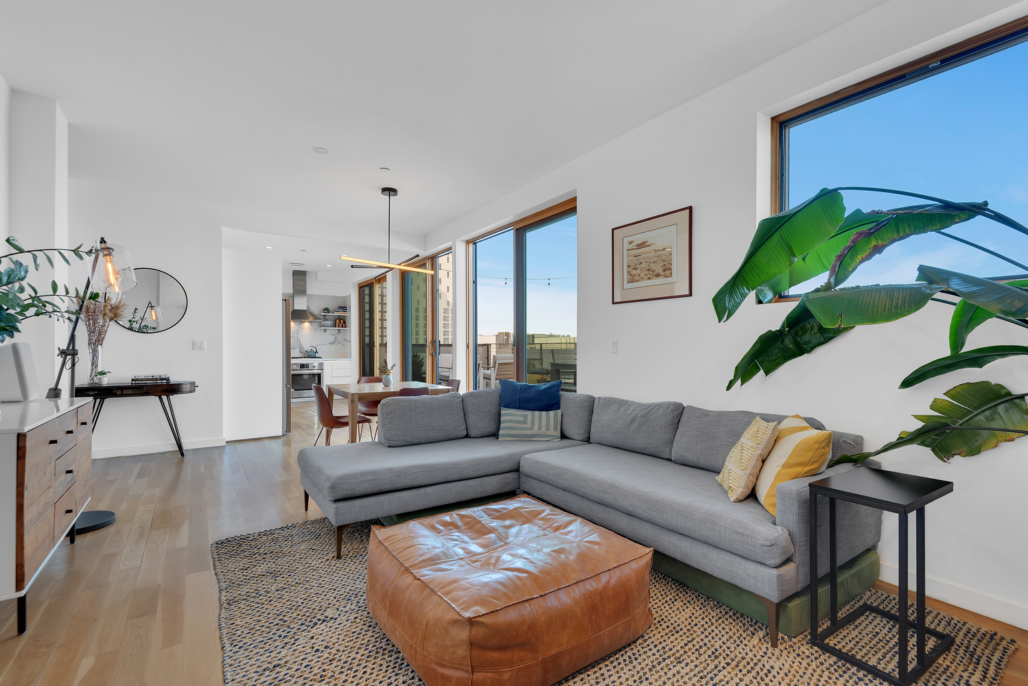 267 Evergreen Avenue, Unit PH Brooklyn, NY 11221 - Photo 1 of 19 a living room with furniture and a potted plant
