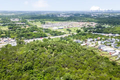 an aerial view of a city with lots of residential buildings