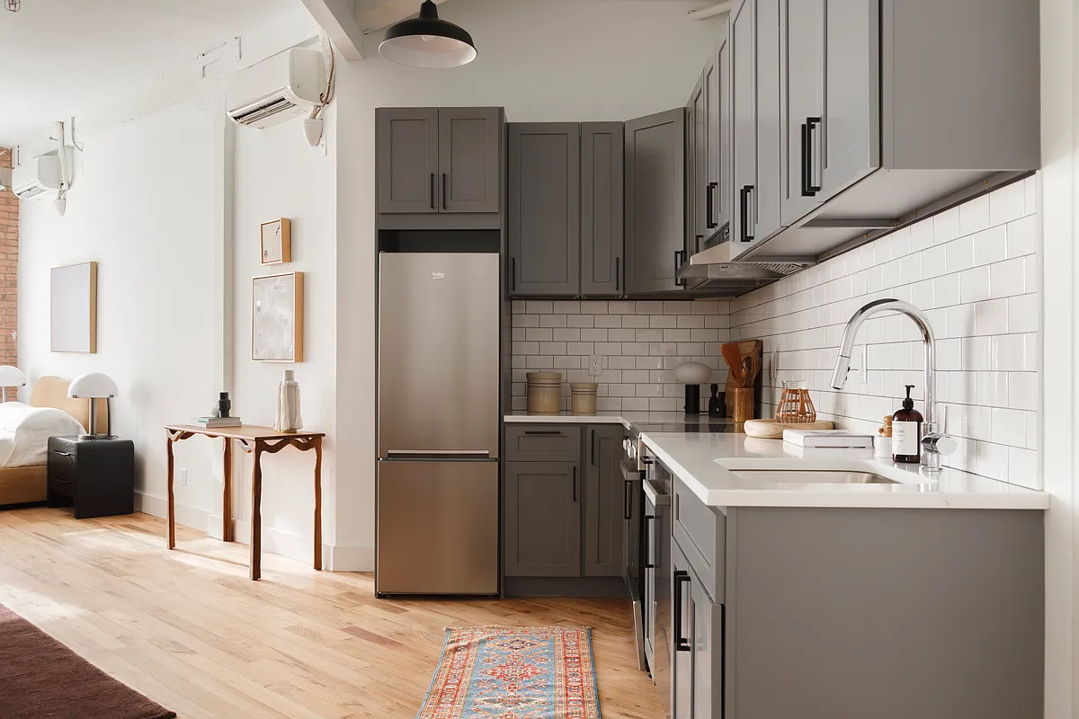 239 Banker Street, Unit 4K Brooklyn, NY 11222 - Photo 10 of 13 a kitchen with stainless steel appliances a refrigerator sink and cabinets