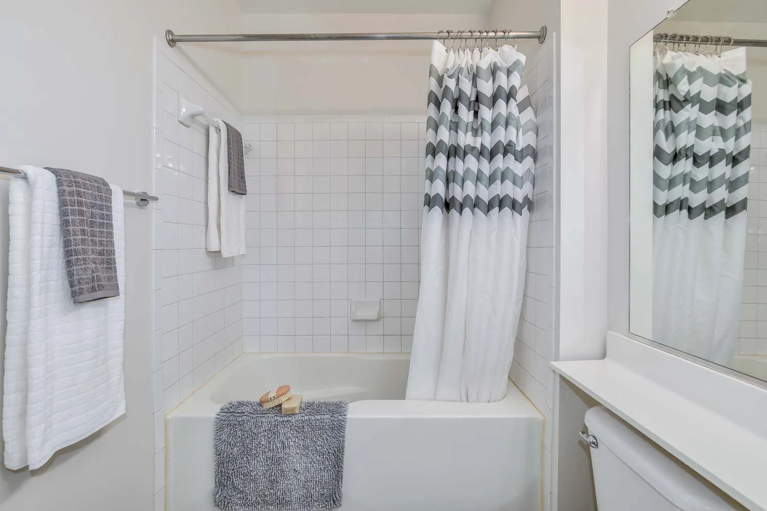 a bathroom with a shower curtain and a sink