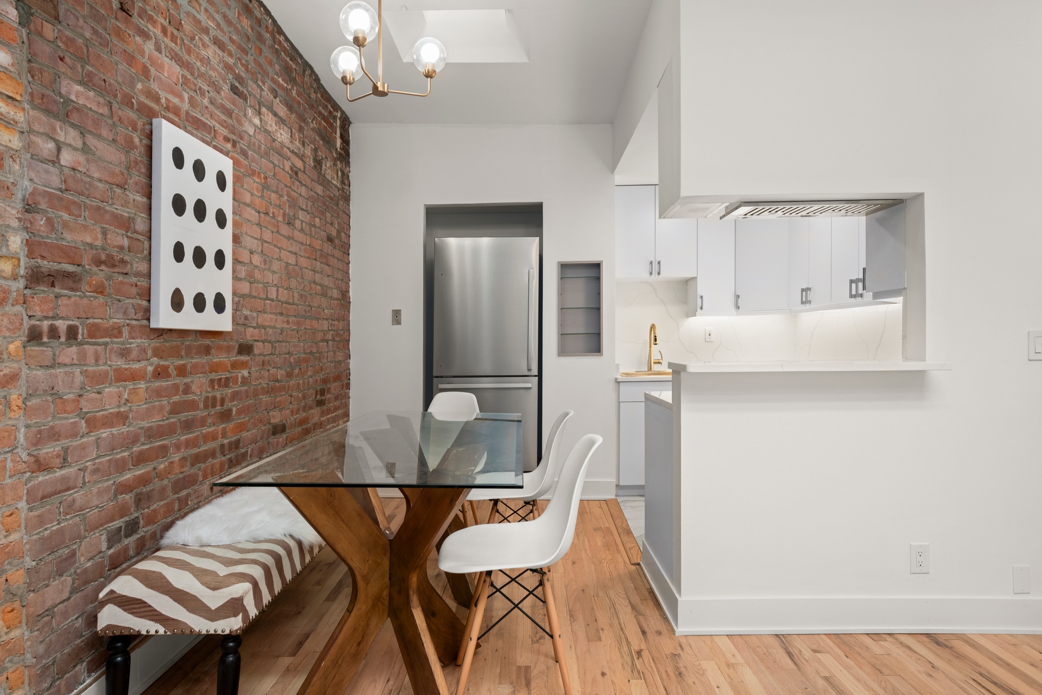 354 West 23rd Street, Unit 4A Manhattan, NY 10011 - Photo 3 of 7 a dining room with furniture and wooden floor