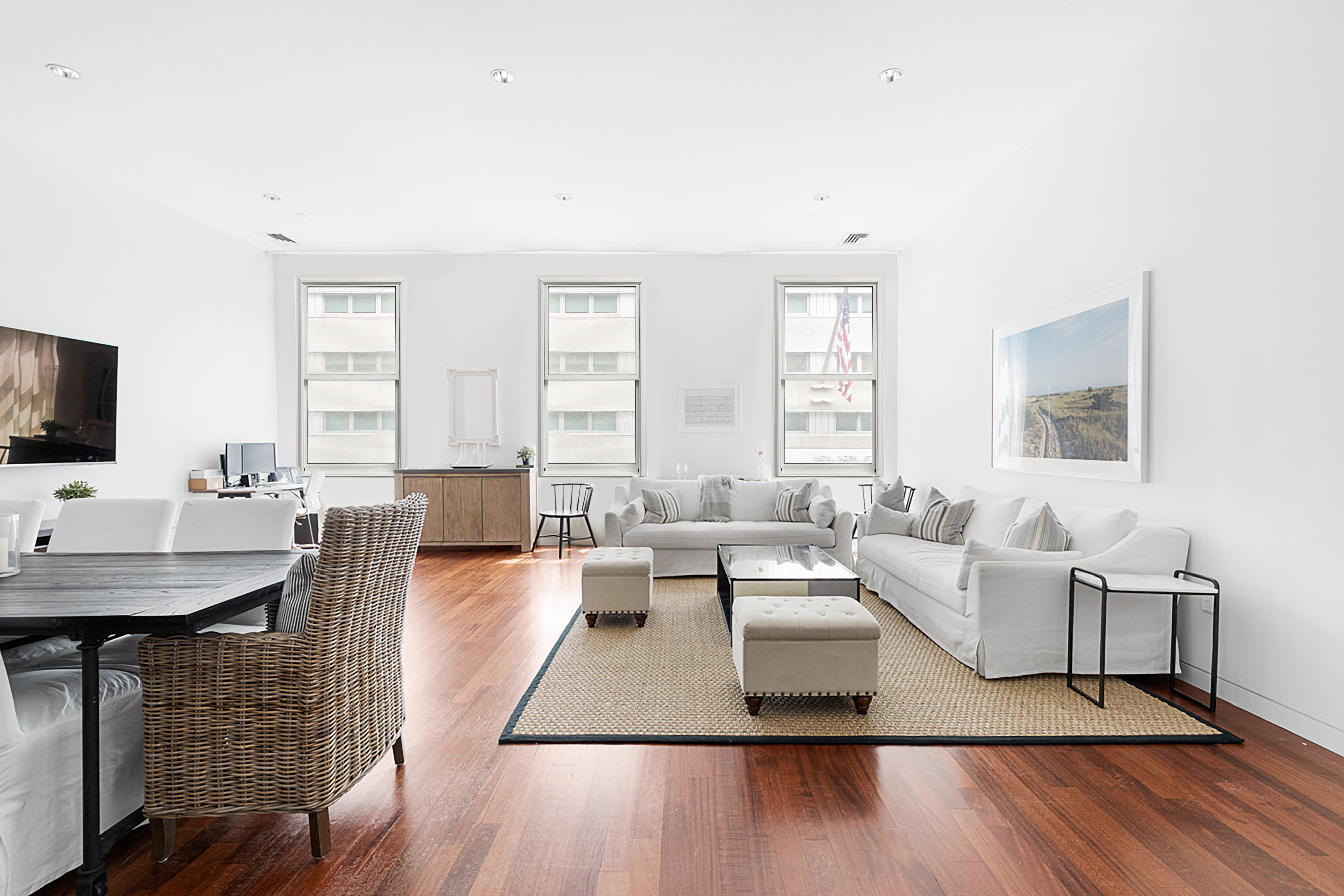 52 Thomas Street, Unit 2B Manhattan, NY 10013 - Photo 2 of 9 a living room with fireplace furniture and a flat screen tv